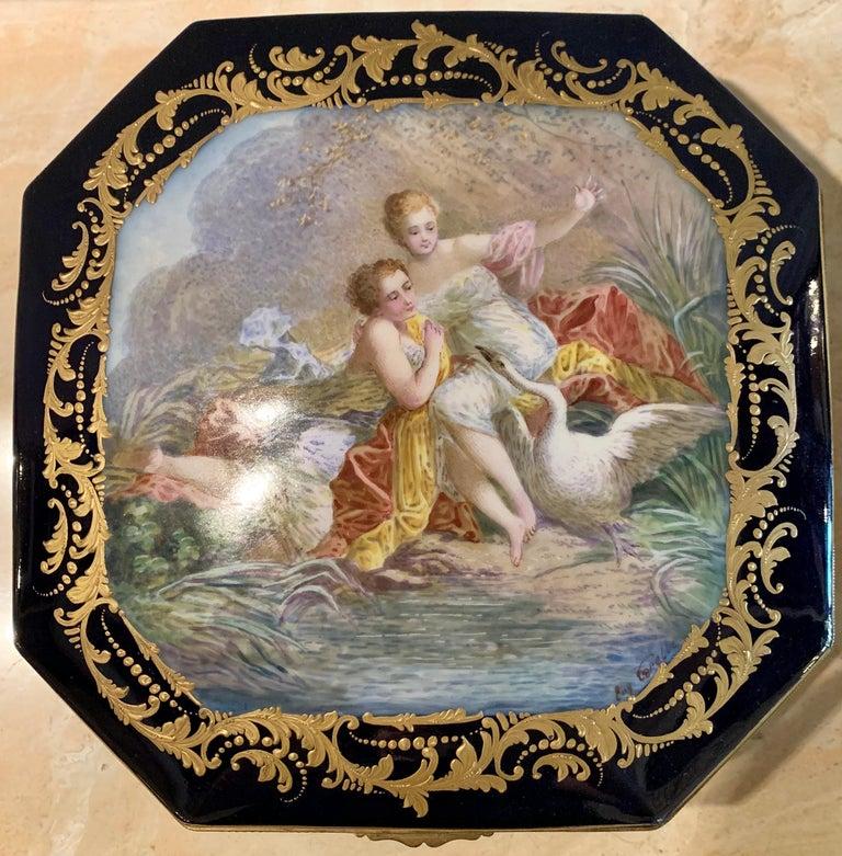 19th century French Sevres cobalt porcelain and gilt bronze casket jewelry box. Having gilt embellishments to interior and hand painted female figures with a swan, signed Corelles in a very fine cobalt blue. Marked to base. Measures: Height 4.5