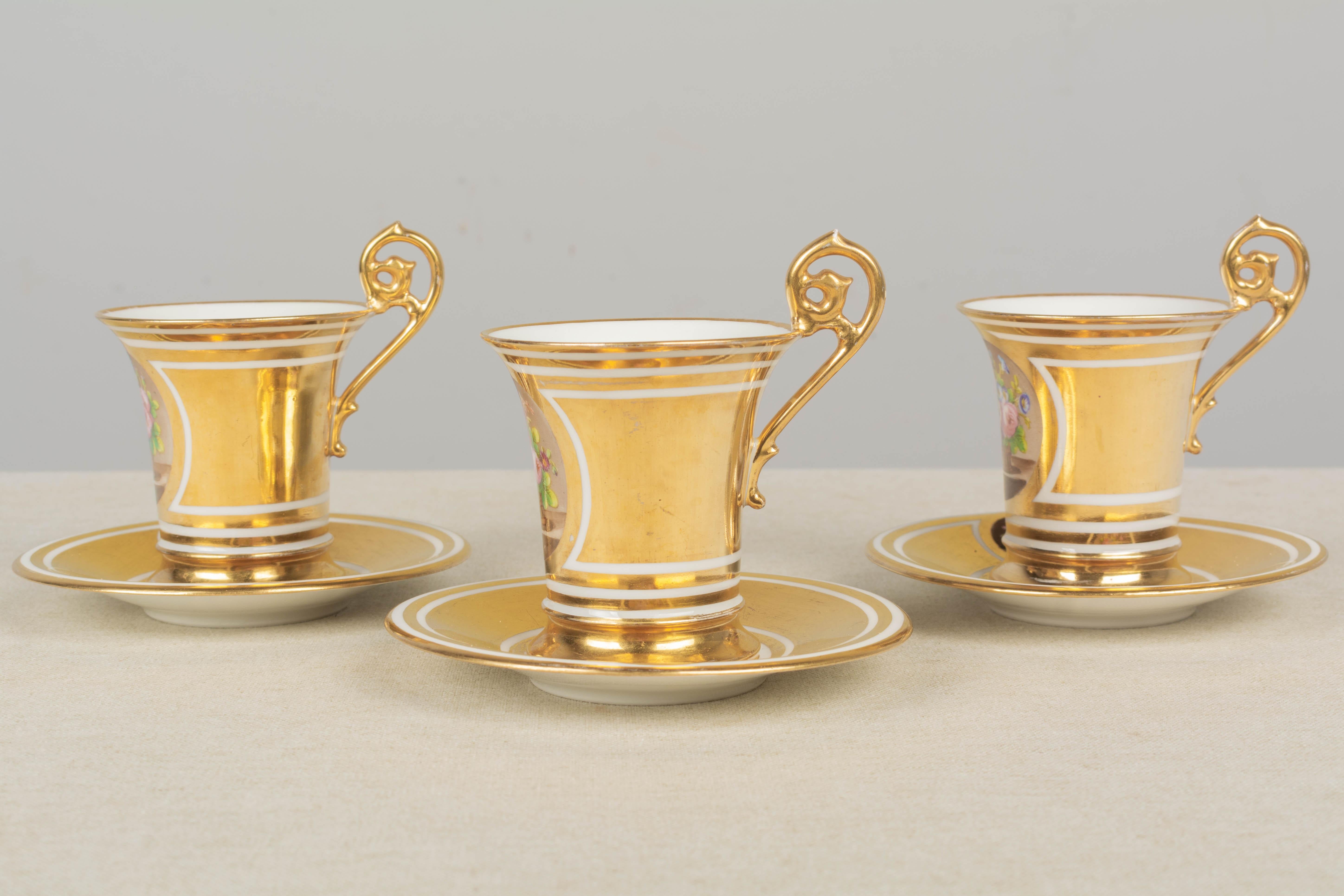 Hand-Painted 19th Century French Sèvres Gilt Porcelain Cup & Saucer, Set of 3 For Sale
