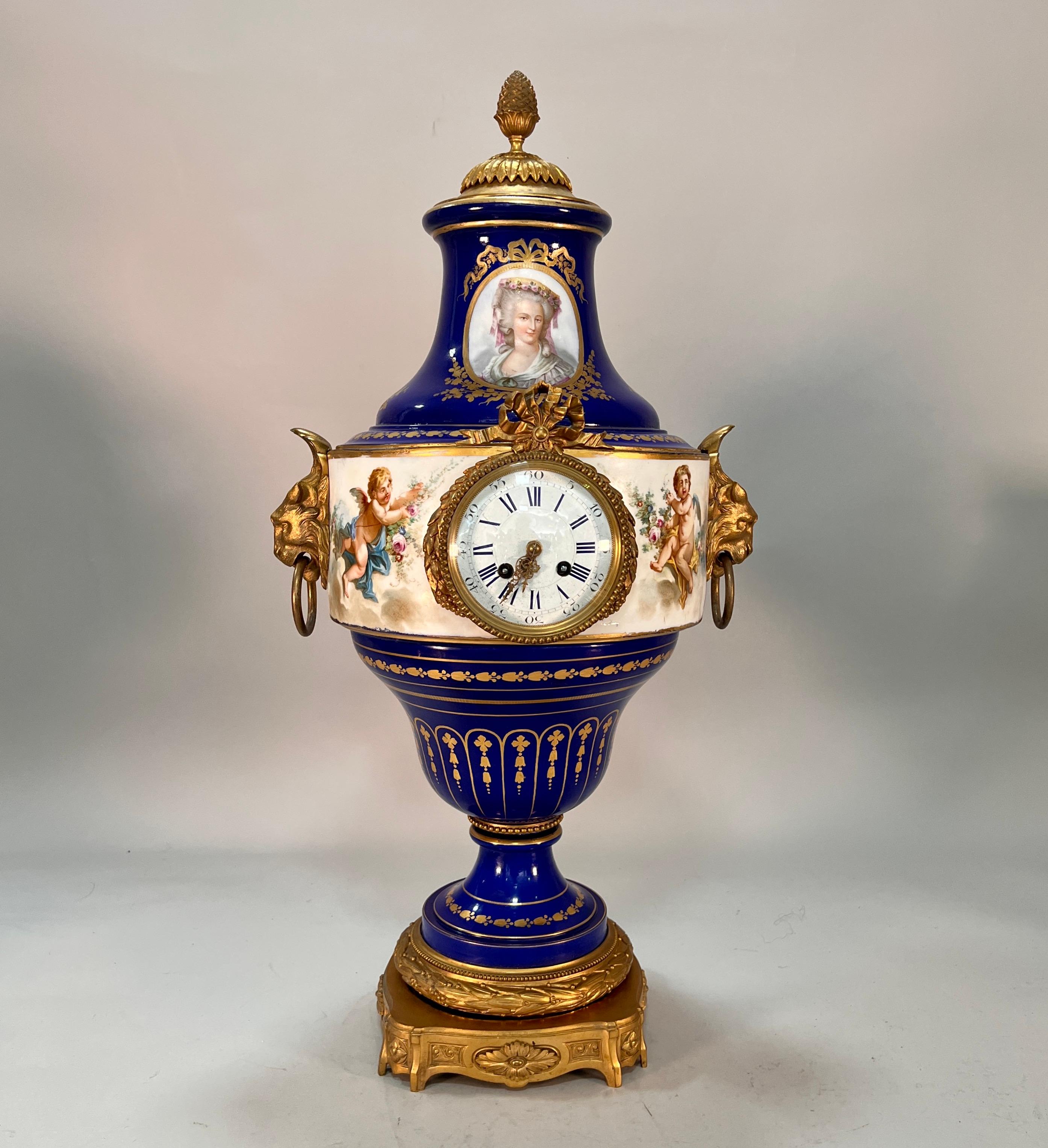 A stunning 19th century French Sevres mantel clock in the baluster shape. style baluster shaped mantel clock. The neck adorned with a two painted oval portraits of elegant ladies. Each portrait captures the grace and beauty of the ladies with