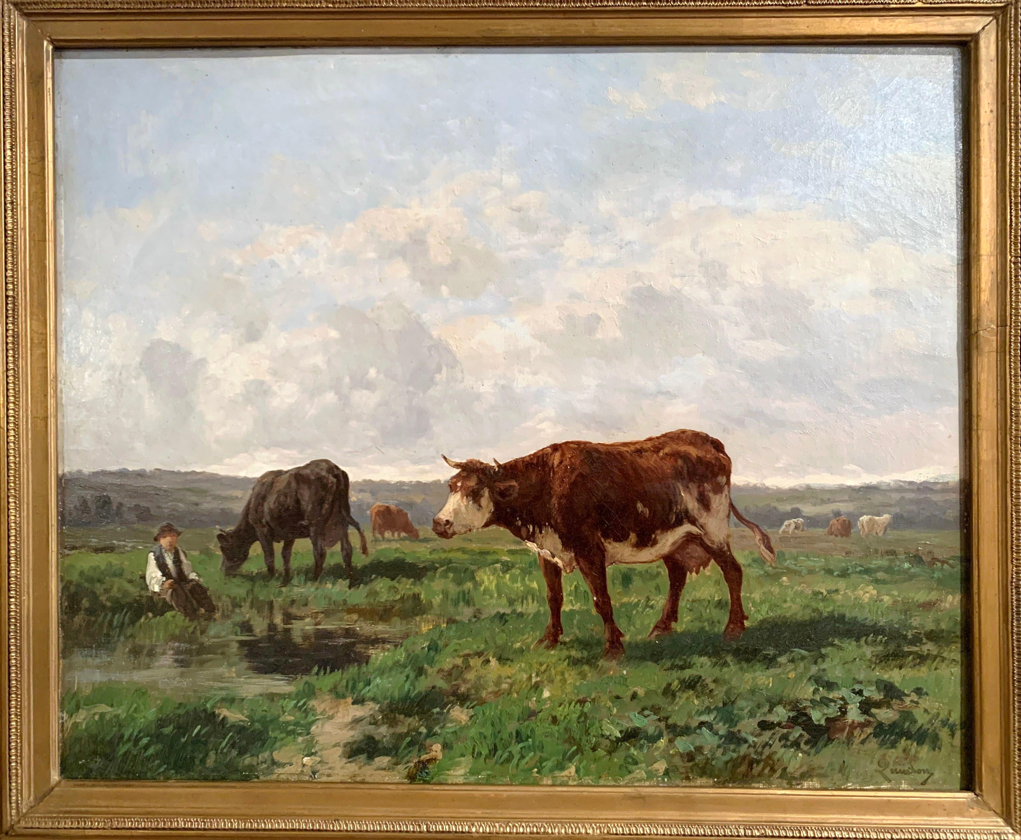 Set in the original carved giltwood frame, this oil on canvas painting was created in France, circa 1880, the peaceful painting depicts a pastoral scene with cows drinking in a pasture while a seated farmer is watching. The artwork is signed on the