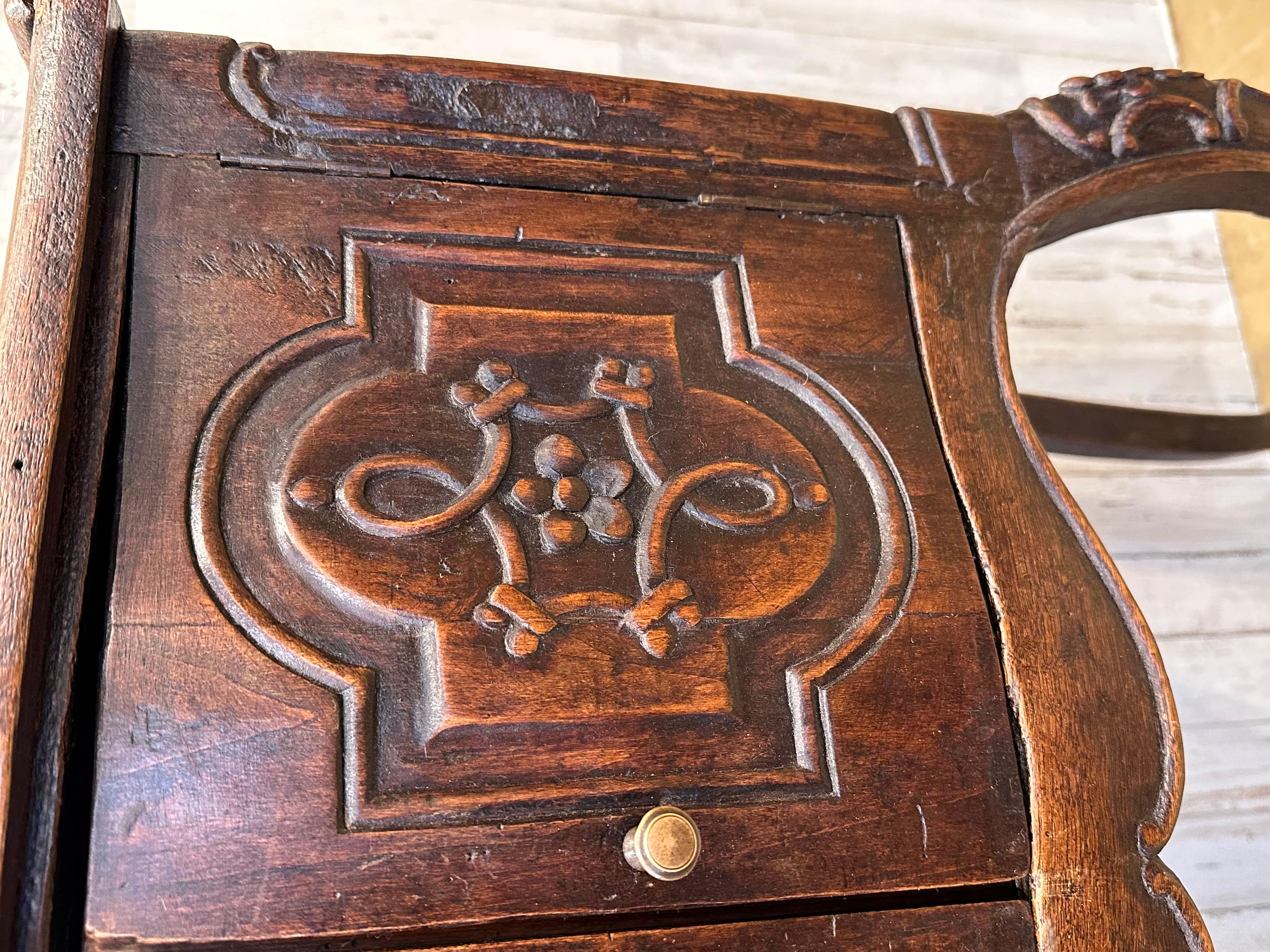 This could be one of the most unusual tables I've ever come across probably a marriage Table that was presented to the couple at their marriage. The bow at the top represents the union of marriage. The age of this is probably around 1820 yeah. When