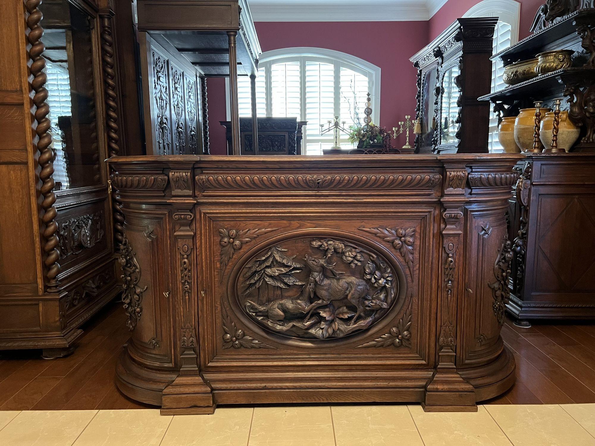 19th century French sideboard server buffet hunt cabinet black forest stag hound.

Direct from a castle estate in France, a large 19th century carved French sideboard hunt cabinet! We recently purchased the entire contents of a gorgeous French