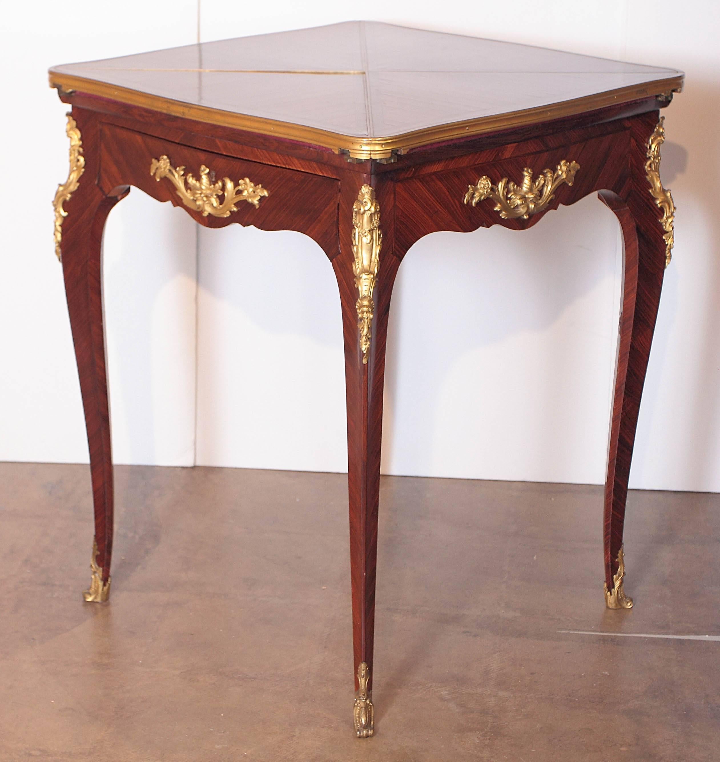 Very fine signed Paul Sormani French Louis XV king wood game table. Envelope designed top opens and swivels for a felt lined game surface. Single drawer signed P Sormani in the lock plate. Fine gilt bronze mounts.