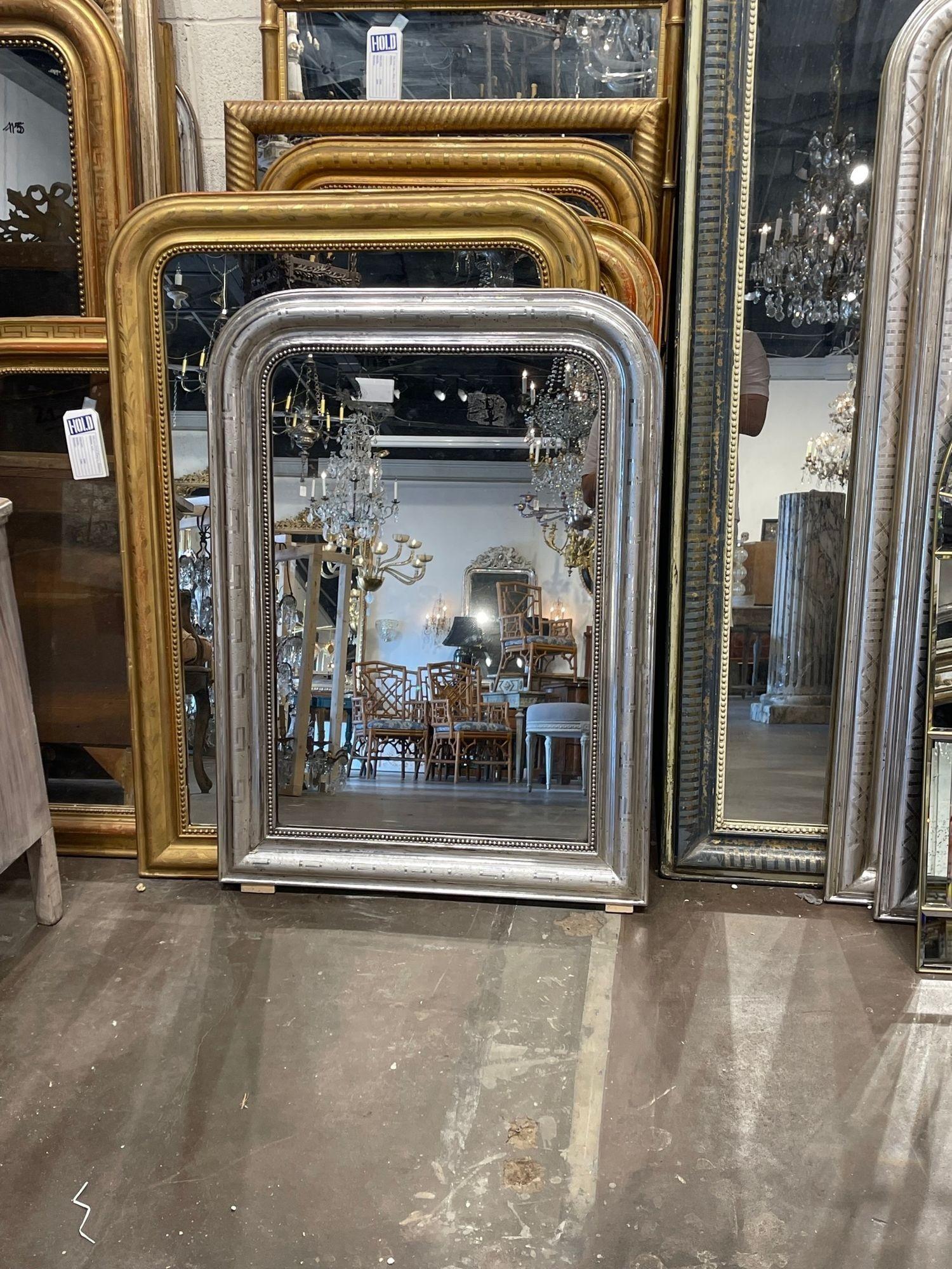 Beautiful 19th century French silver leaf Louis Philippe mirror with Greek key pattern. The mirror also has a beaded inner border. A classic piece that is sure to impress!
