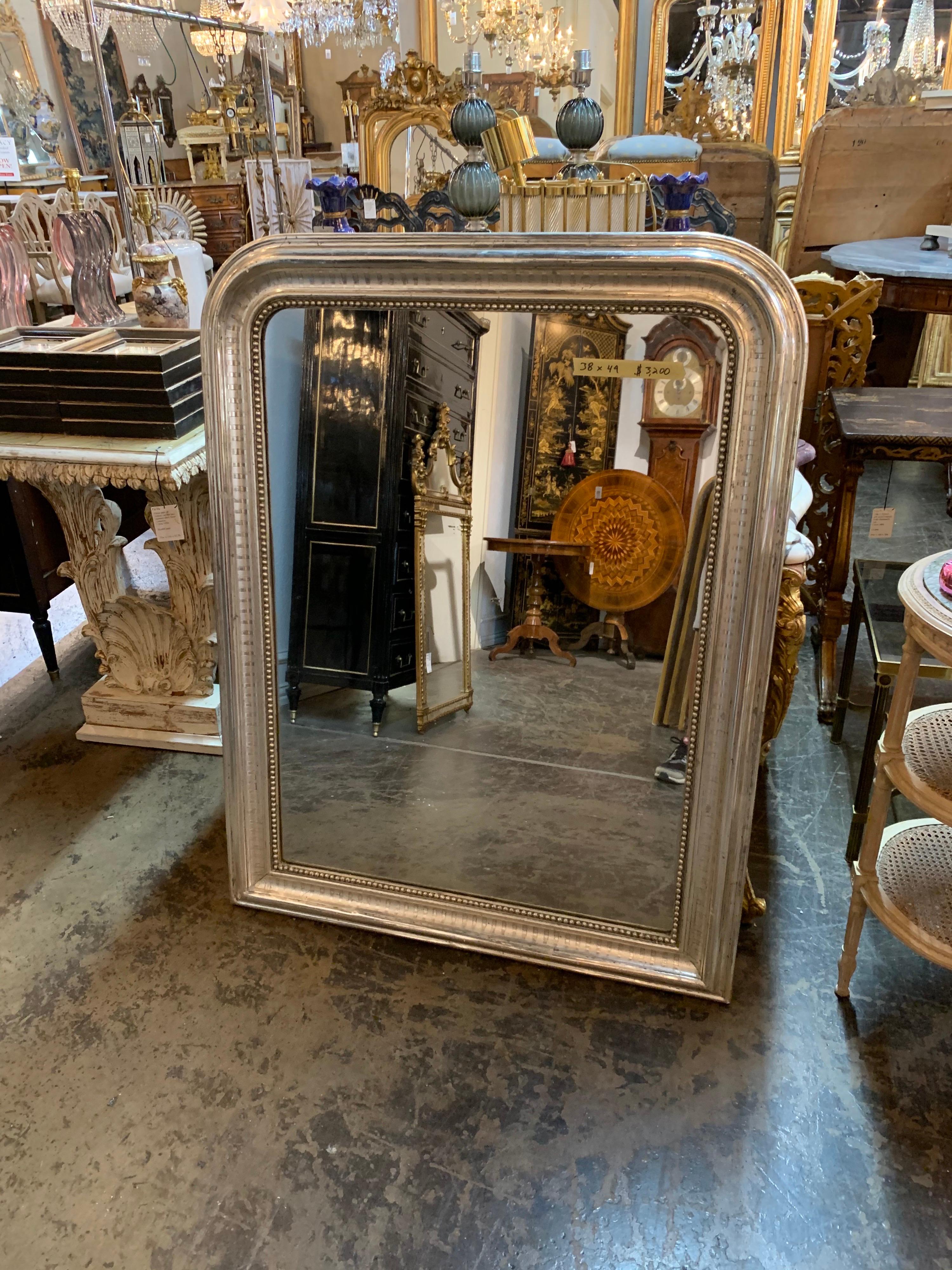 Fabulous 19th century French silver Louis Philippe mirror with bar pattern and beaded inner border. So pretty and mixes well with a variety of decors!