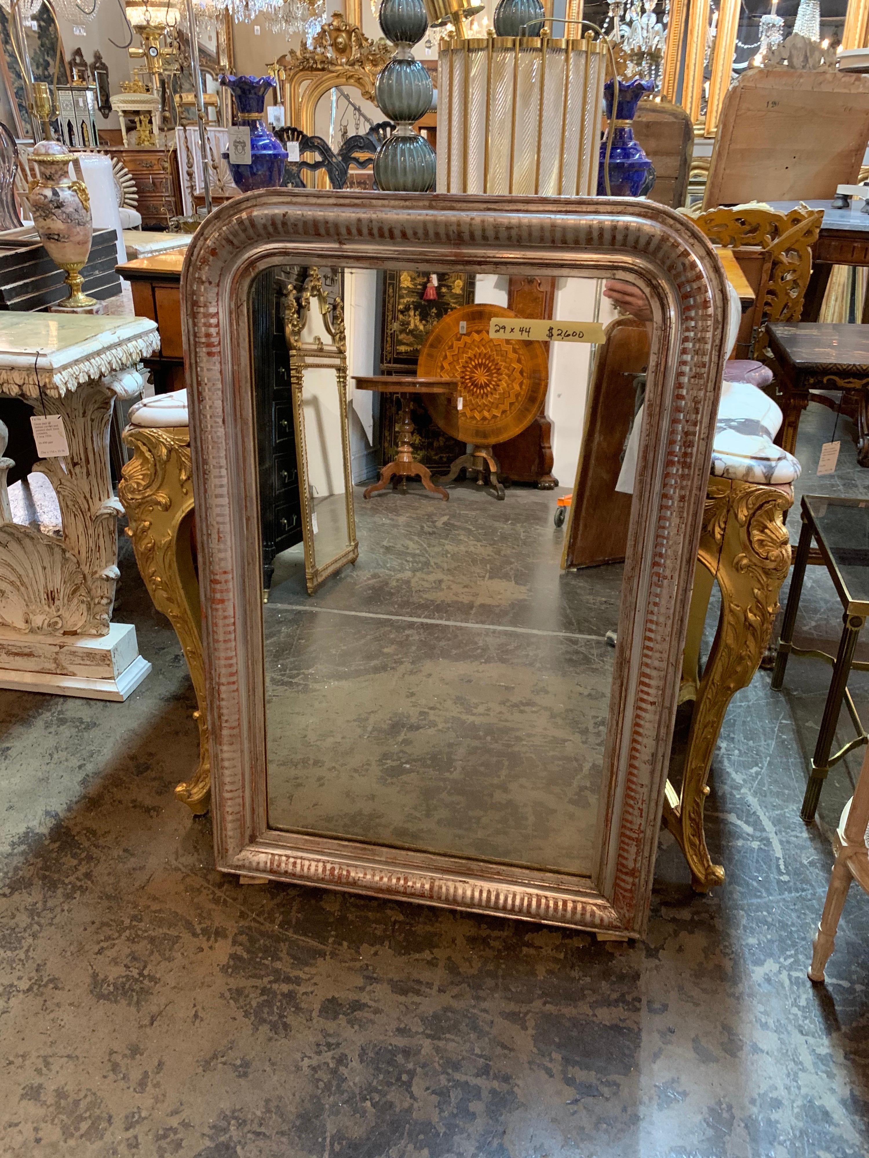 Very fine 19th century French silver Louis Philippe mirror with bar pattern. Also red tone through out the mirror. Great for a variety of decors!