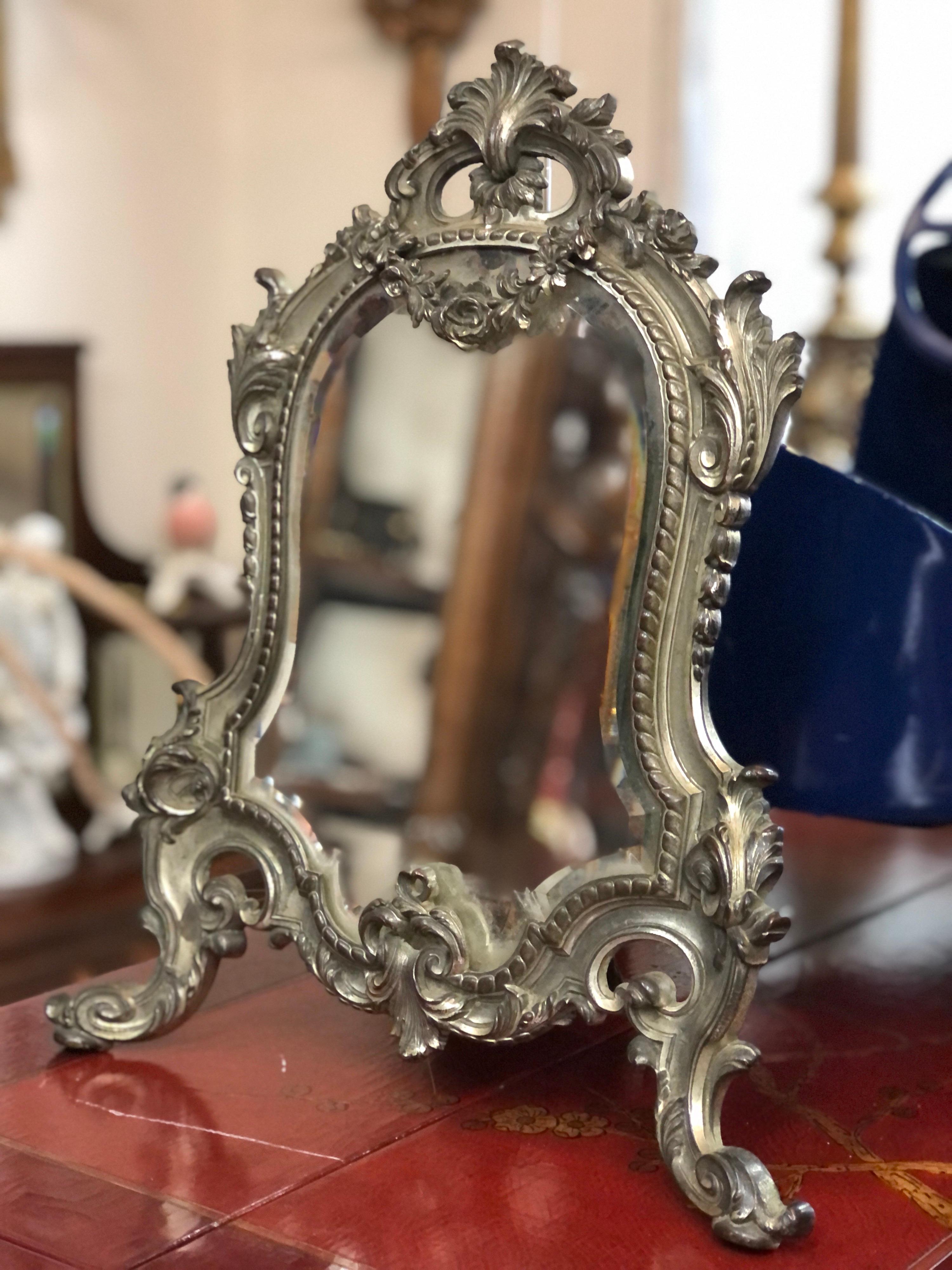French silver plated bronze vanity mirror richly decorated in Louis XVI style.
Circa 1880.
