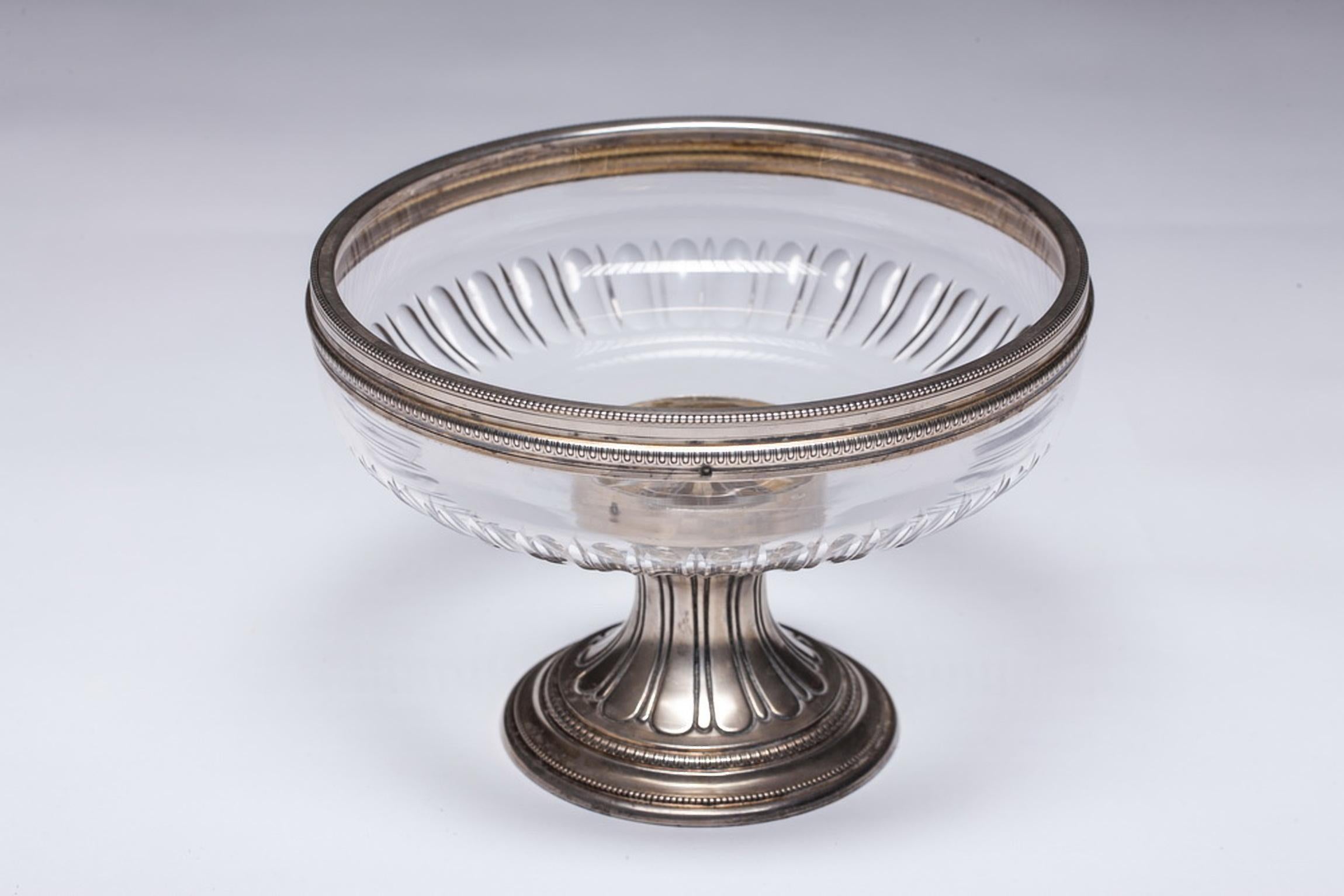Superb and authentic antique French Napoleon III silver plated centerpiece 19th century stamped on foot.
The centerpiece is topped with a round cut-glass bowl, and has silver base. The piece is in good condition with fine detailed work.

 