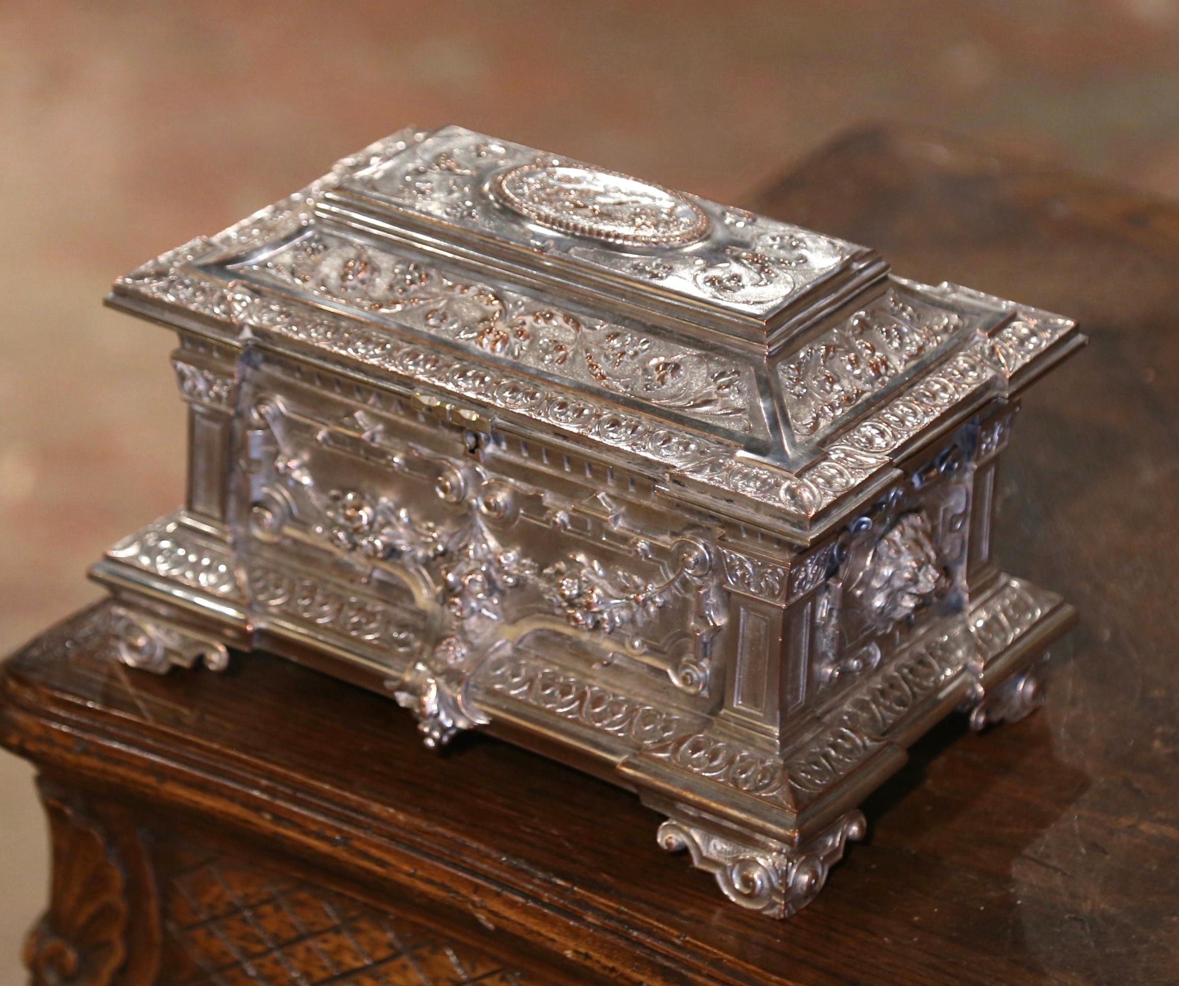 Place this elegant, antique Napoleon III silverplated box in your master bath to keep your jewelry safe and organized. Crafted in France circa 1870, and built of bronze, the rectangular casket with raised top, sits on small scrolled feet, and is