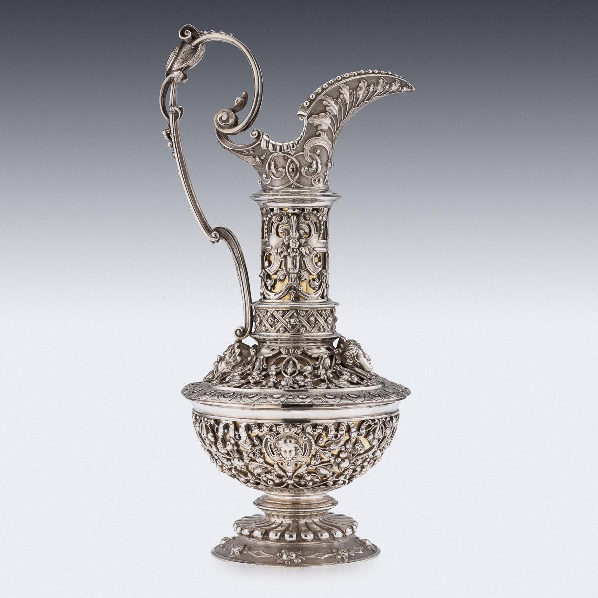 Antique 19th century French unique and exceptional solid silver figural ewer, raised on a circular foot applied with cast mythological figures, the tall baluster shaped, double walled body is gilt and further applied with cast scrolling foliage