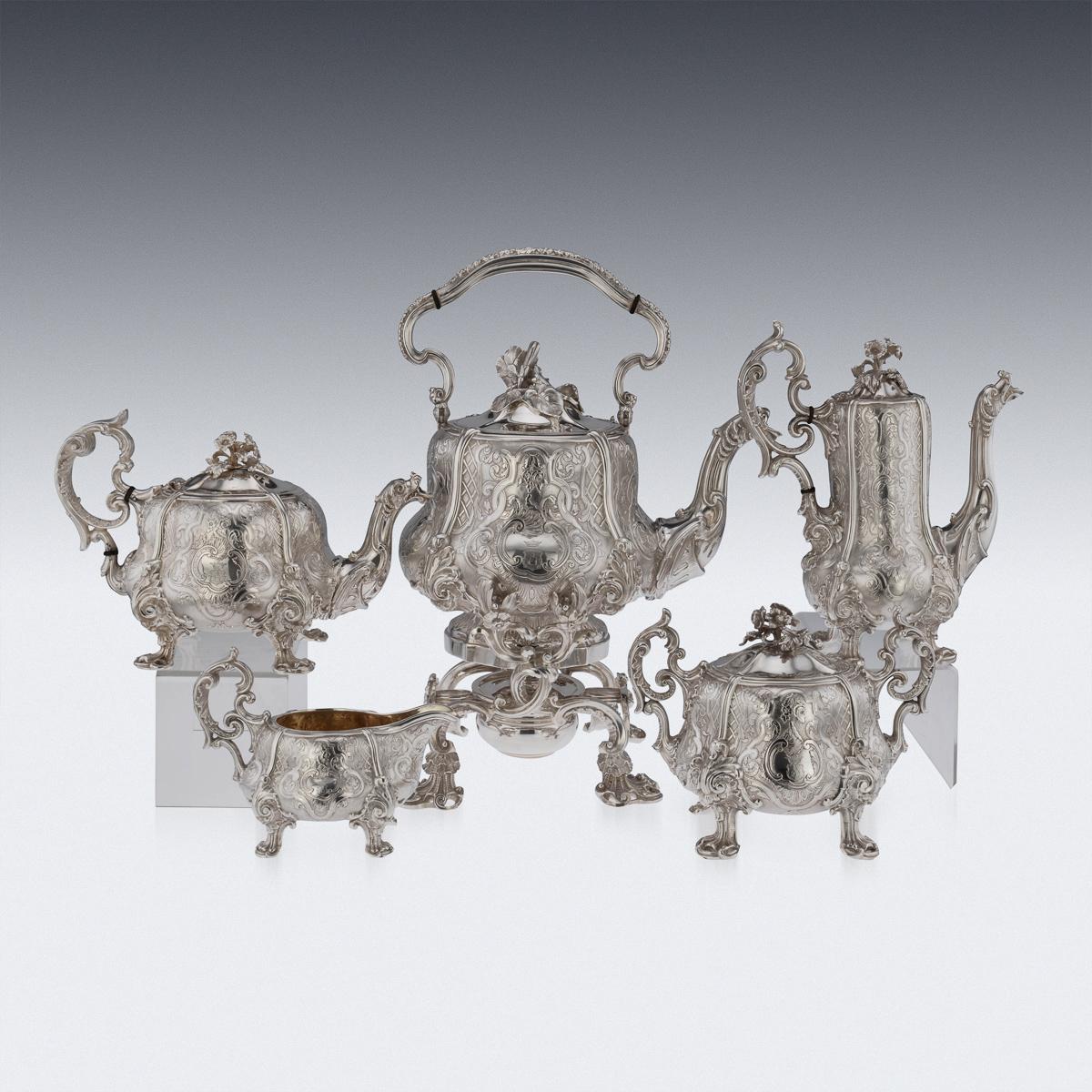 Antique 19th century French exceptional solid silver tea service, comprising: Kettle on stand, teapot, coffee pot, lidded sugar bowl and cream jug; all circular shaped with panels chased with latticework and foliate scrolls on a matted ground, the