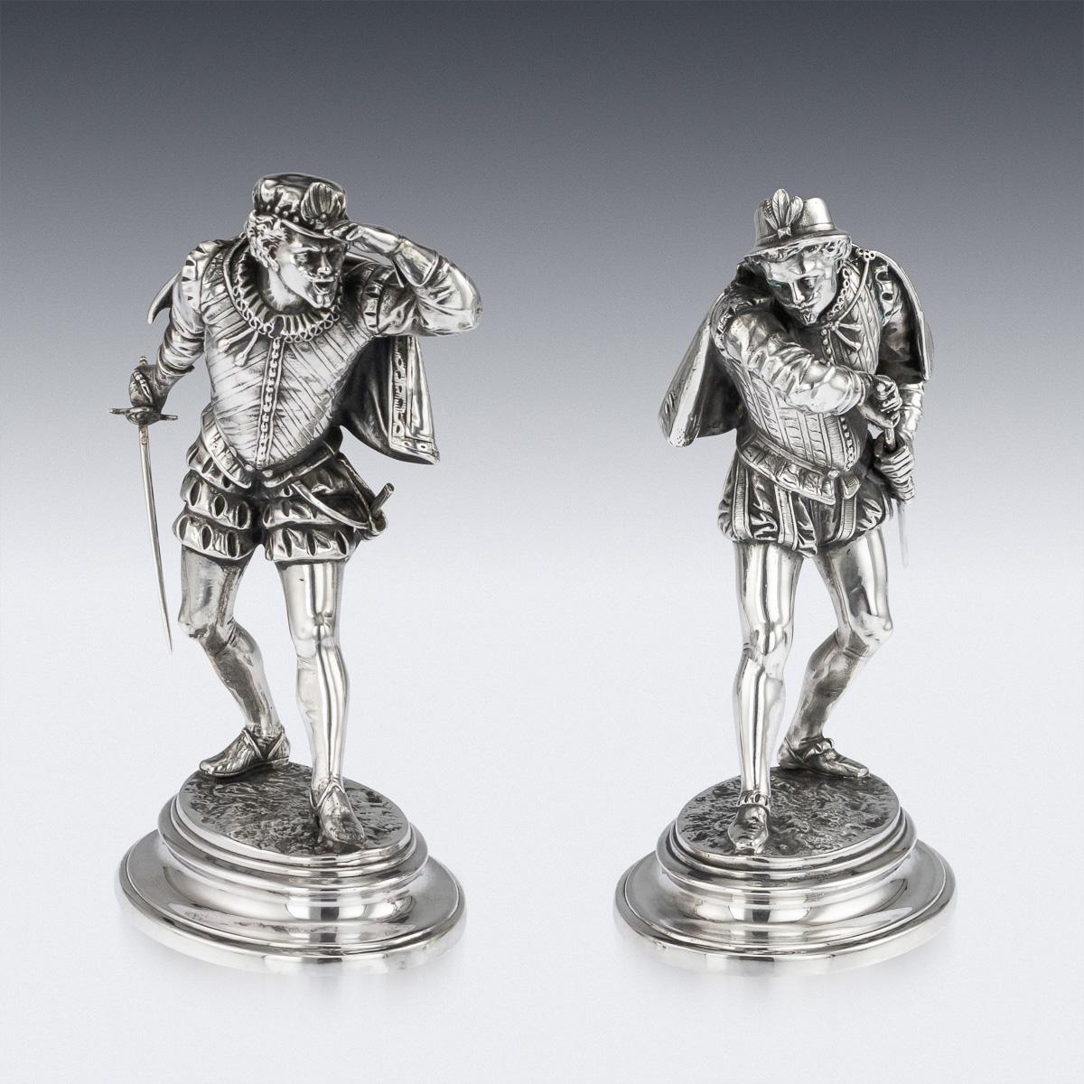 Antique 19th century French solid silver pair of magnificent statues, beautifully modelled to the last detail as two duelists, each with sword in hand, dressed in the style of Renaissance, standing on oval plinth bases, circa 1880. Hallmarked with a