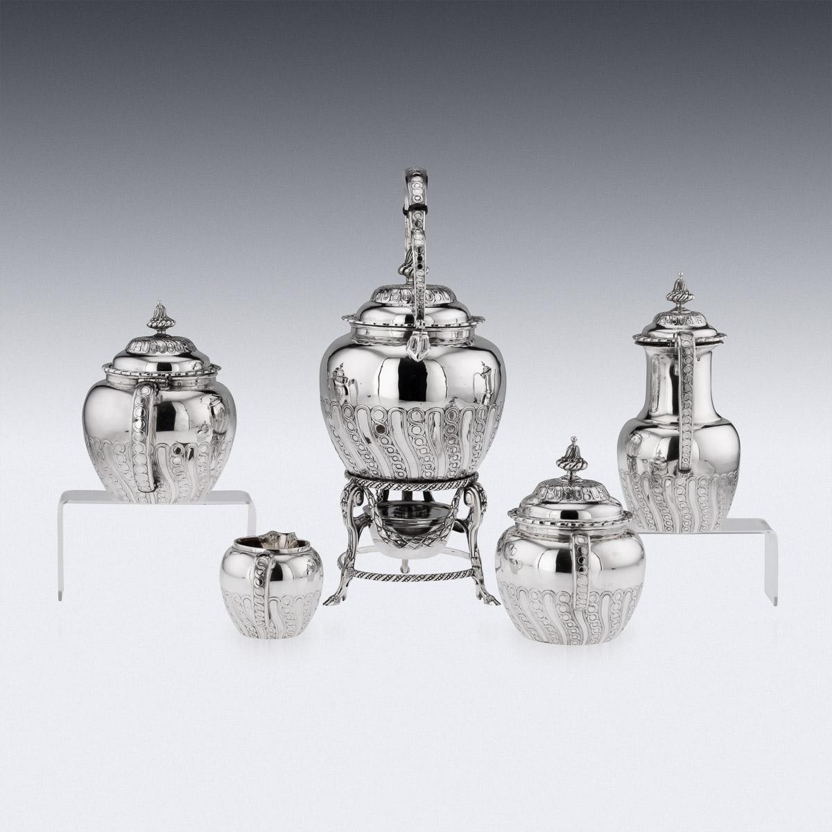 19th Century French cased tea service, comprising: a water kettle, coffee pot, teapot, lidded sugar bowl, silver cream jug, oval dish, a bowl, sugar tongs, toast rack, two egg cups on stands and a double salt with a spoon.
Hallmarked French silver,