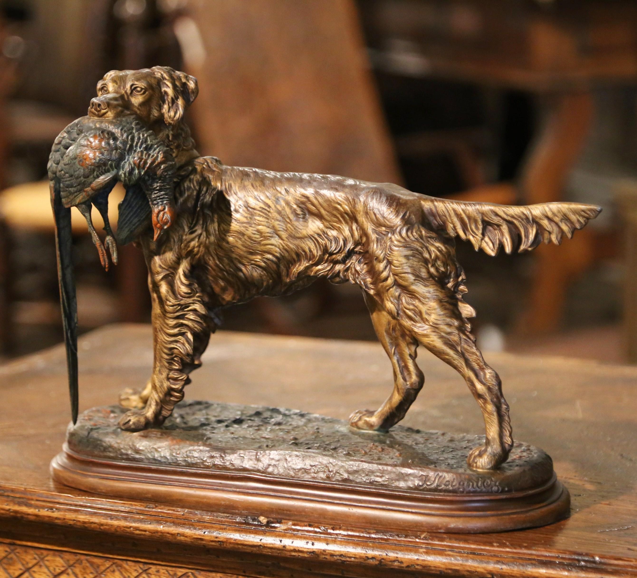 Decorate a man's office or library with this antique dog and bird sculpture. Created in France circa 1870, and standing on an oval base, the sculpture composition depicts a hunting setter holding a pheasant in his mouth; the sculpture is signed on