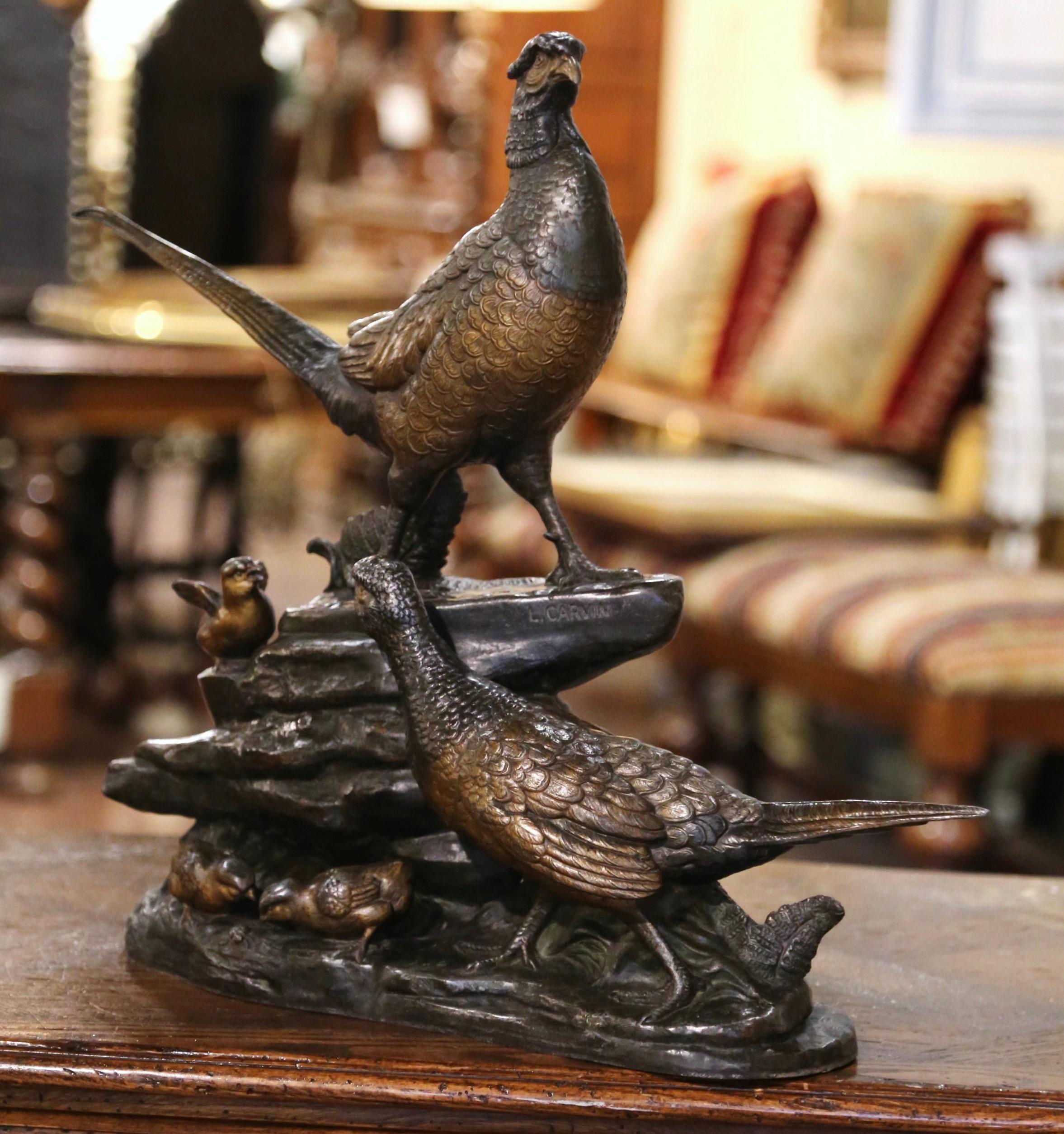 Decorate a man's office or study with this large antique pheasant composition. Created in France circa 1890 and built of spelter, the large sculpture depicts a group of pheasants and chicks standing on a rocky form base. The composition shows a