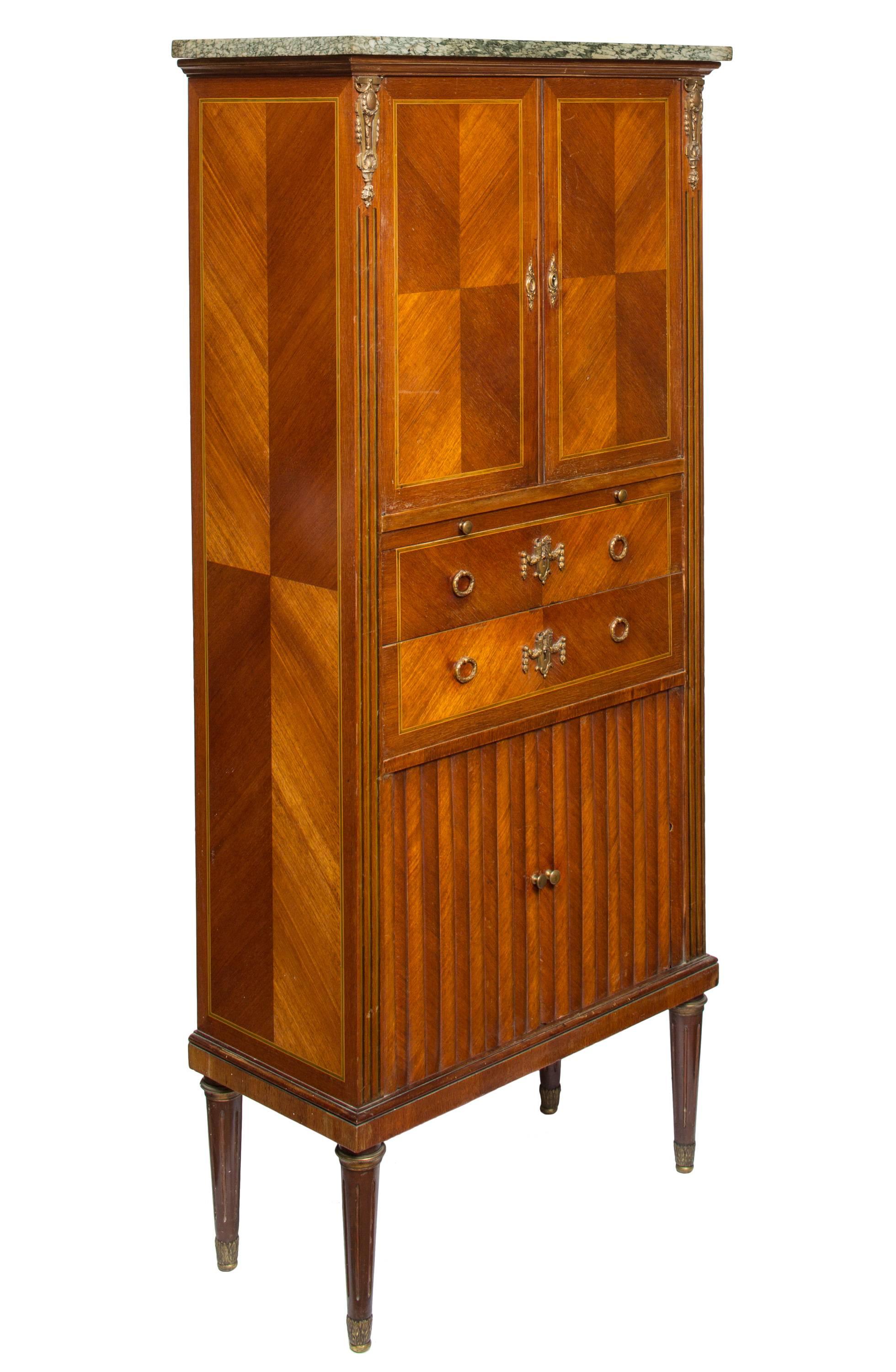 A 19th century, French secretaire with beautiful feathered woodwork, eucalyptus fillet inlay and marble top. The wood grain veneer is artfully arranged in geometric patterns on both front and sides. Featuring a slide-out writing surface at center,