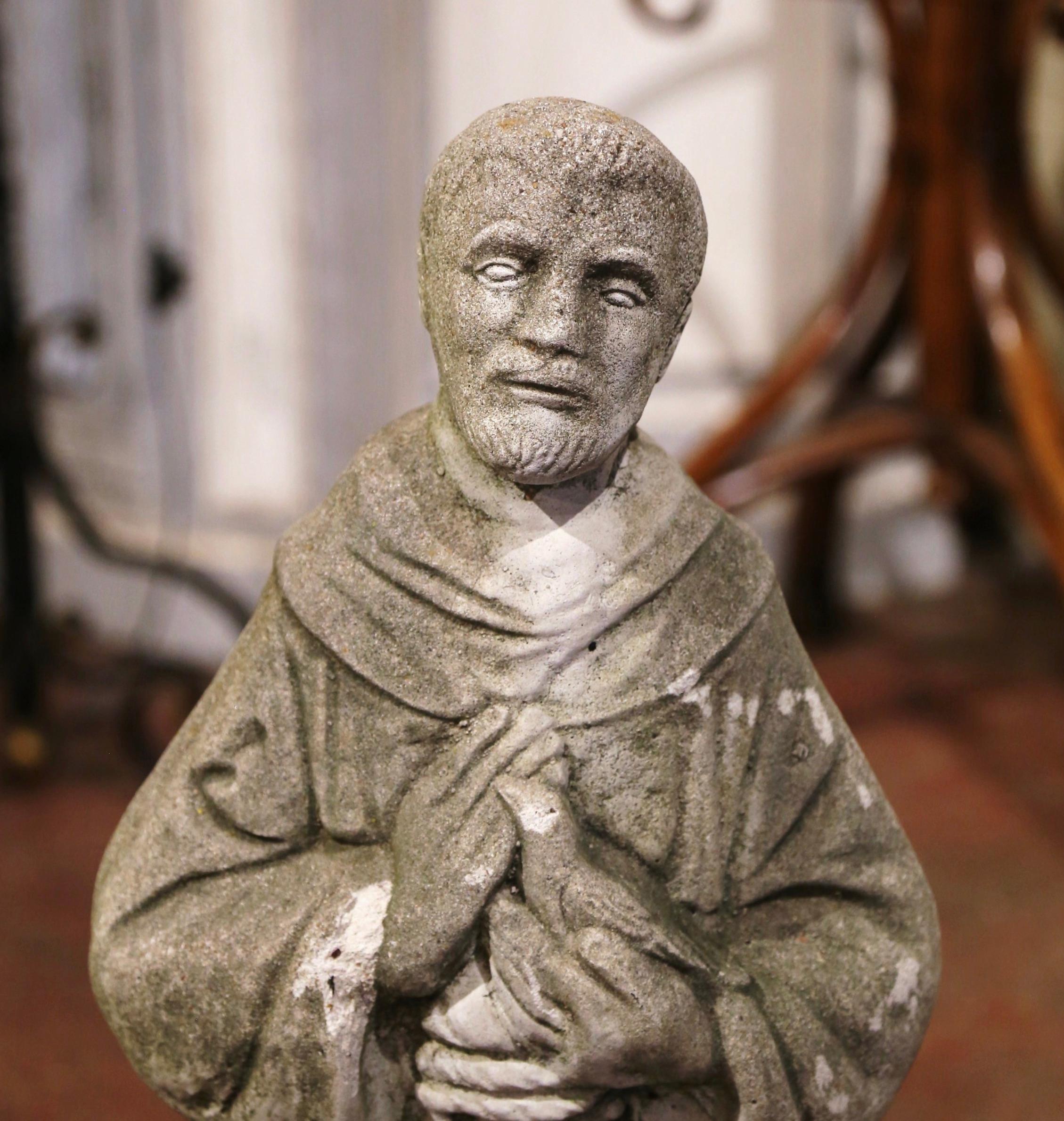 Decorate an outdoor garden with this antique statue of Saint Francis, the saint patron of animals; crafted in France circa 1880, the carved statue stands on a round base and features the Saint dressed in cassock, holding a dove in his hands, and