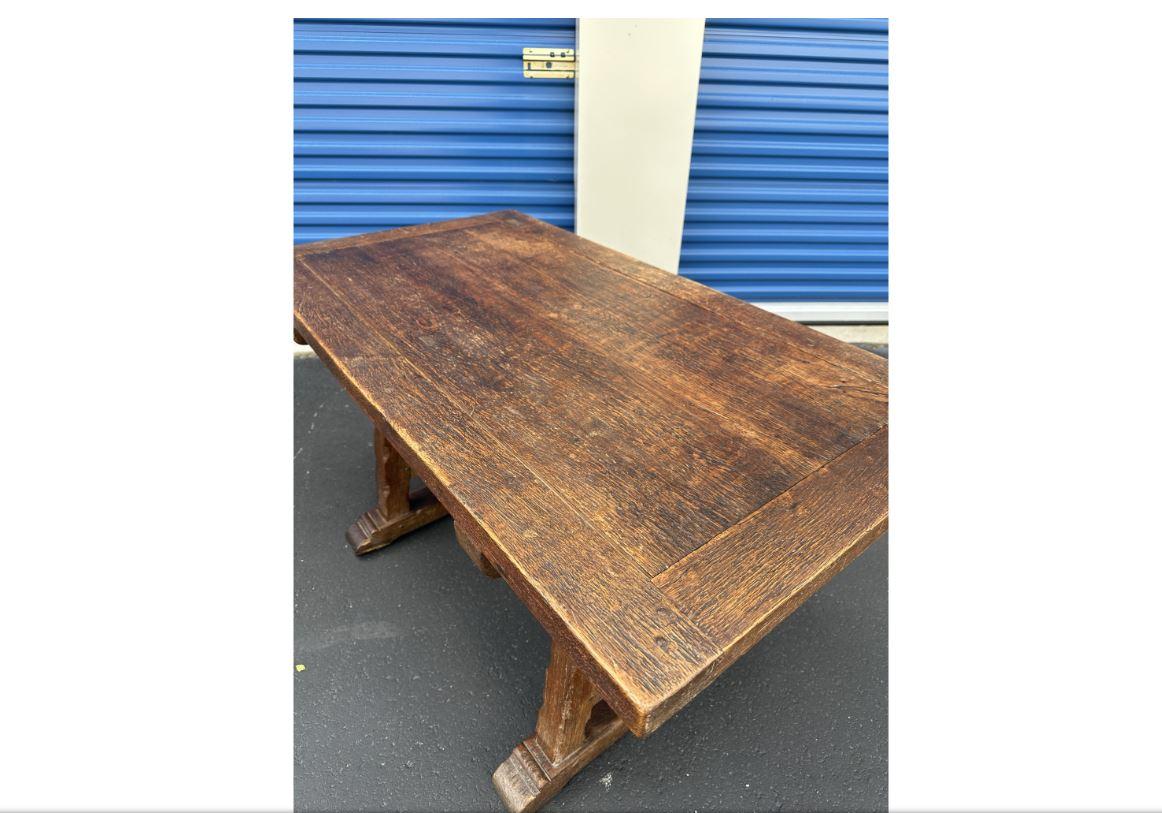 This is a beautiful table from 19th century France. This piece has a rustic feel to it, with lovely patina and texture, and trestle base. It could make an excellent entry table, or it would also make a great desk!  #712