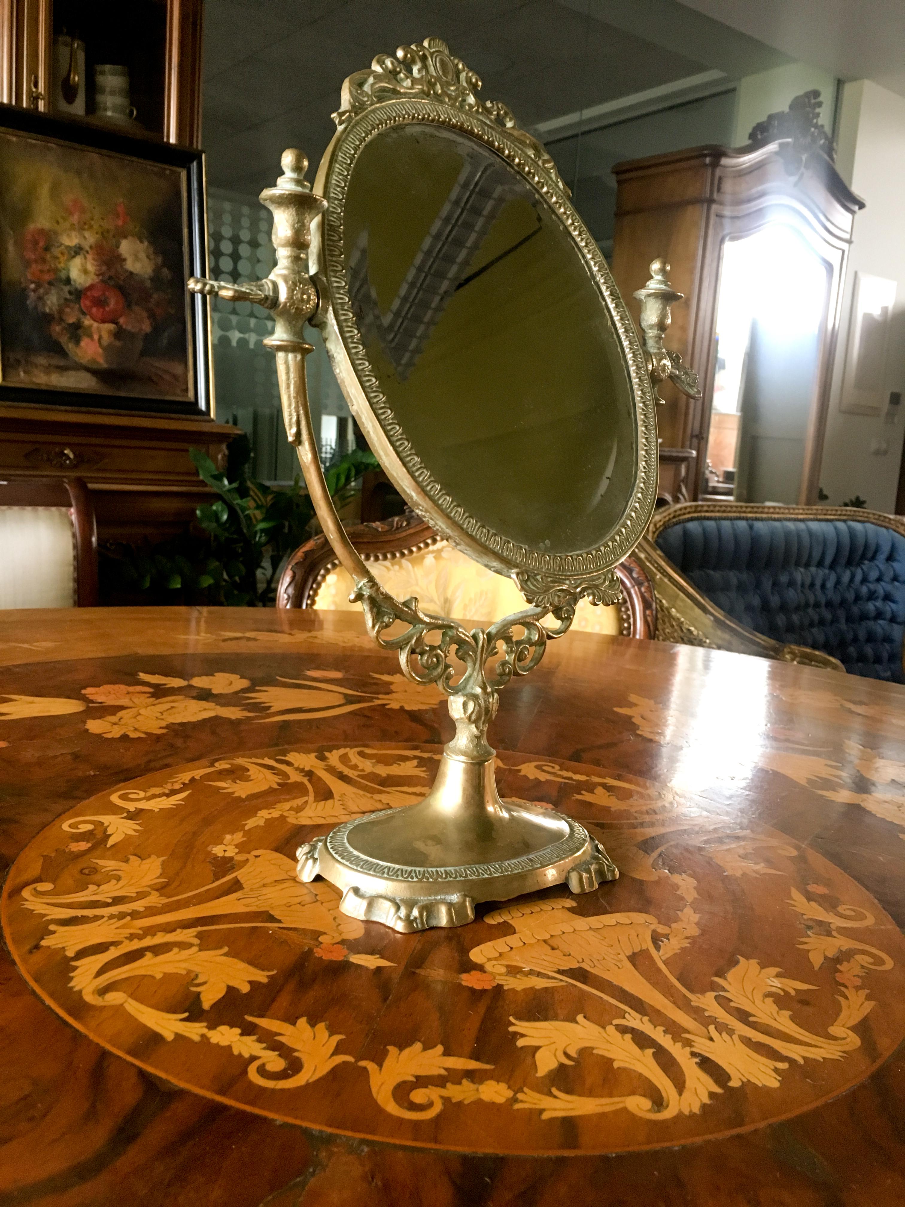 19th century gilded bronze table mirror decorated with palmettes, a graphs, sheets of water and foliage.
France, circa 1870.
   