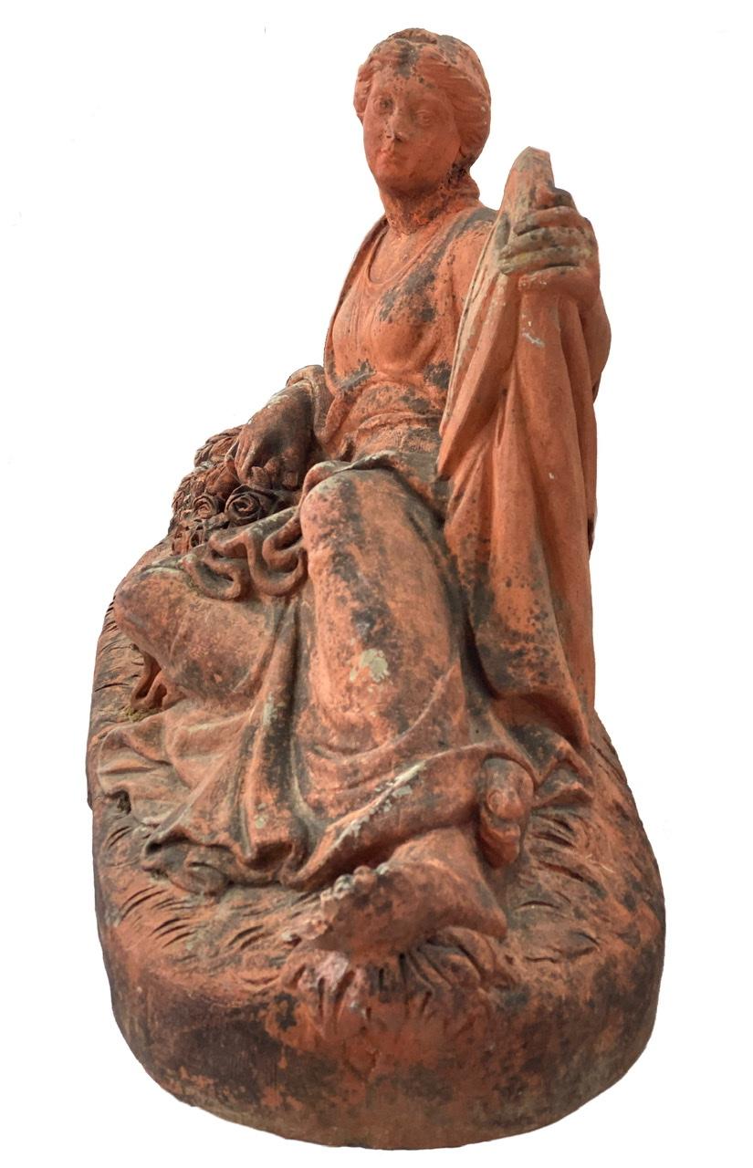 This beautiful 19th century French terracotta sculpture of a lady has very detailed carvings. This is a very detailed piece that would be gorgeous on a table or shelf. The piece is from Toulouse, France.