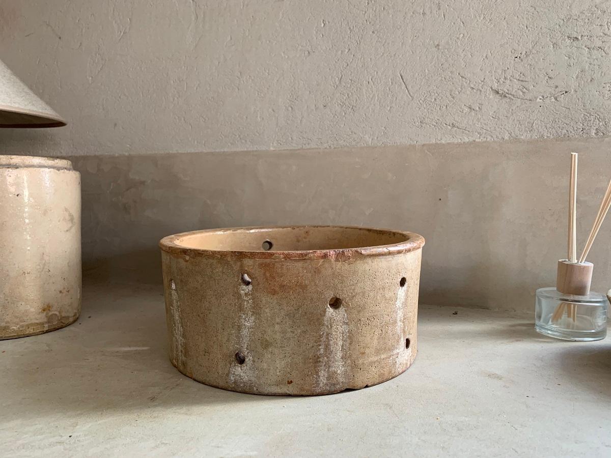 An attractive 19th century French cheese mould. This terracotta vessel has great colors and patina and without cracks. It is not only a great decorative item but also reconnects us with centuries of knowledge in organic and fermenting processes.