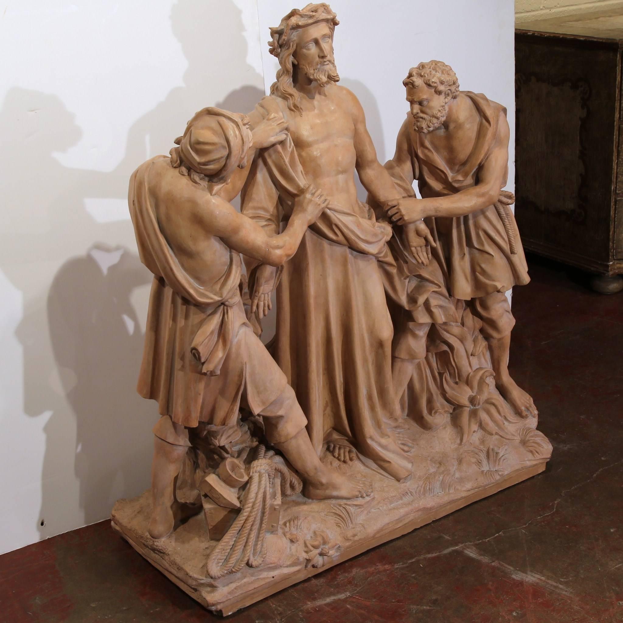 This important, antique sculpture was crafted in France, circa 1860, the composition depicts the tenth station of the cross when Jesus clothing are being removed.
In the biblical composition, Christ is being stripped of his garments by two