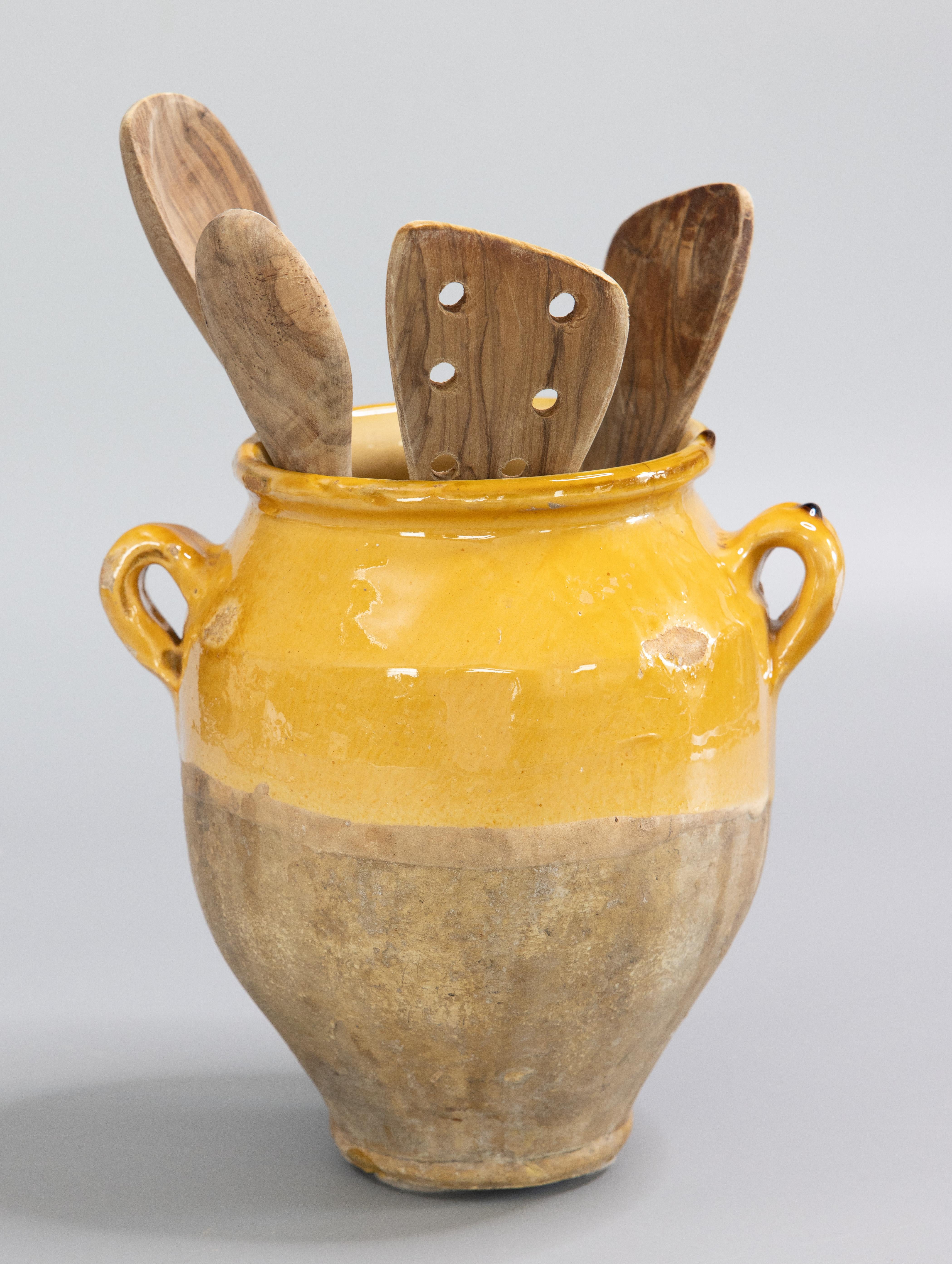 A superb 19th century French confit pot with lovely drippy mustard yellow glaze. This pot or planter is hand thrown with charming handles known as 'ears'. These jars were used for storing and preserving cooked meat. It would be beautiful with a