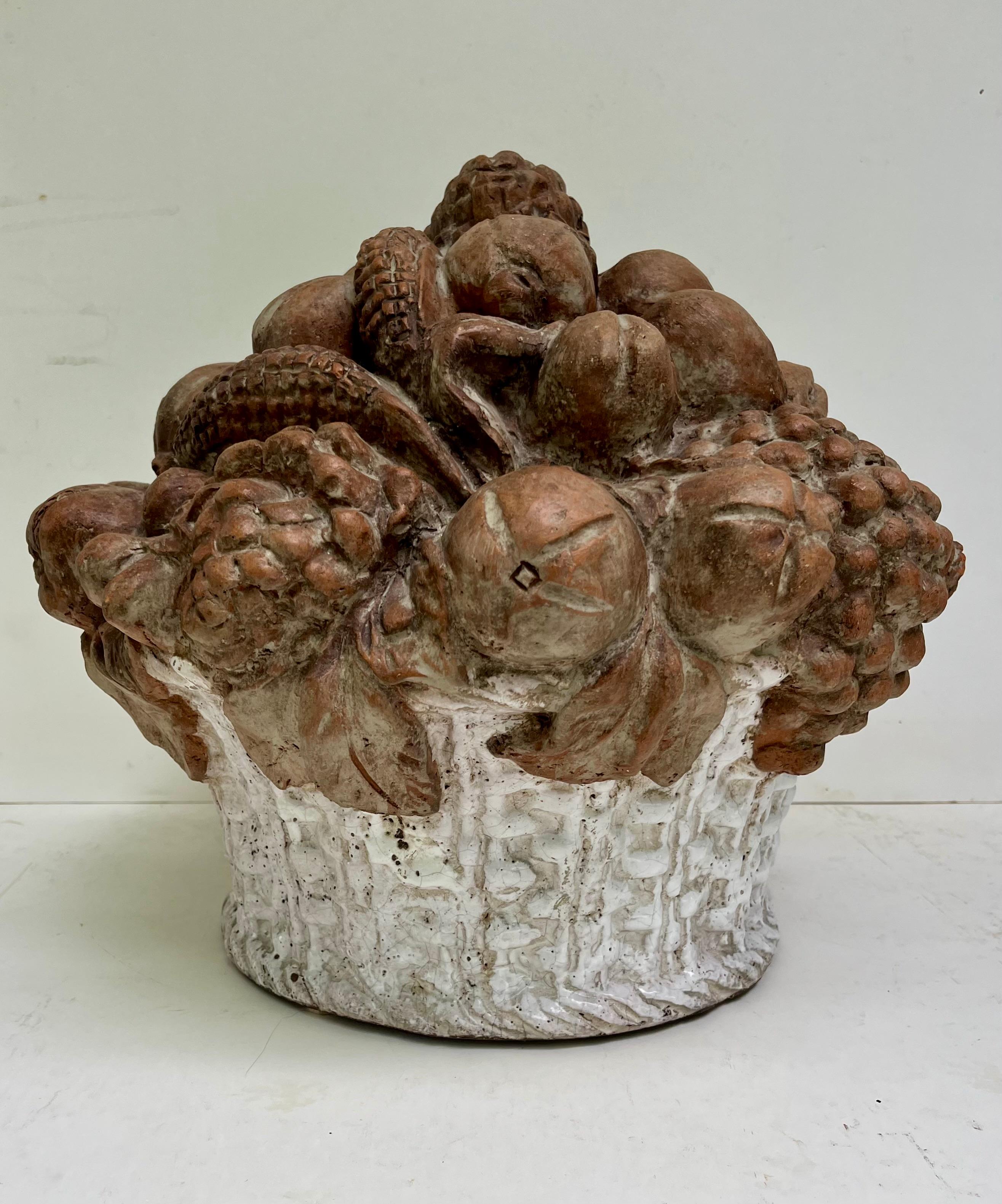 19th Century French Terracotta Fruit Basket Centerpiece Sculpture 

Handmade, large, refined terracotta basket centerpiece features intricately crafted fruits. The decorative sculpture, with its rustic charm, adds an ornamental element to a table