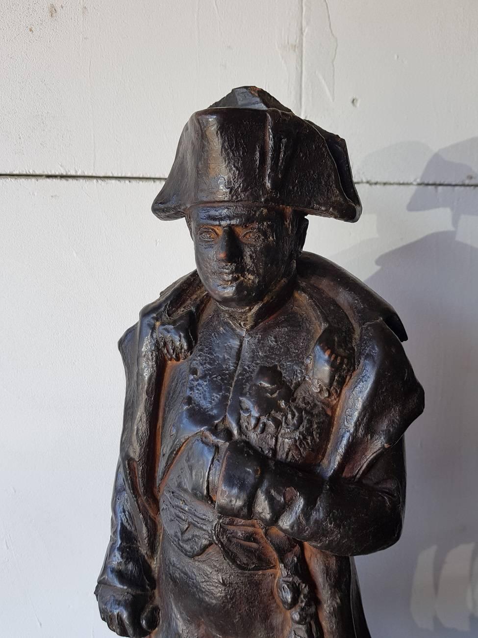 19th century large size terracotta statue depicting Napoleon Bonaparte made by a unknown artist and has some old damage to the hat which is restored only by color.

The measurements are,
Depth 20.5 cm/ 8 inch.
Width 22 cm/ 8.6 inch.
Height 55