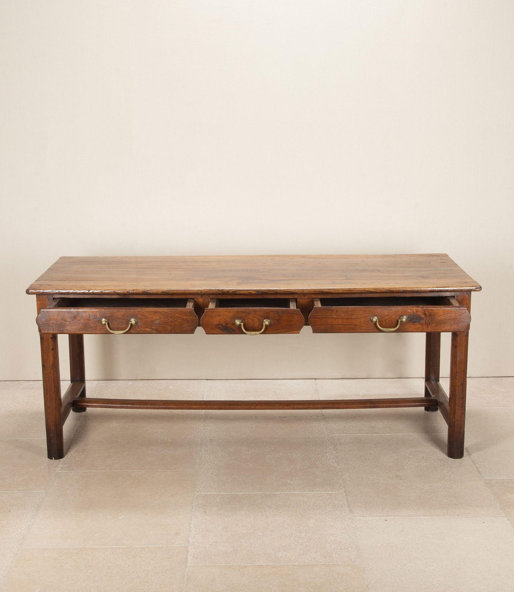 Mid-19th Century French oak three drawer console table or serving table.With original handles. The legs have been capped, cleaned and wax polished.Circa 1850.