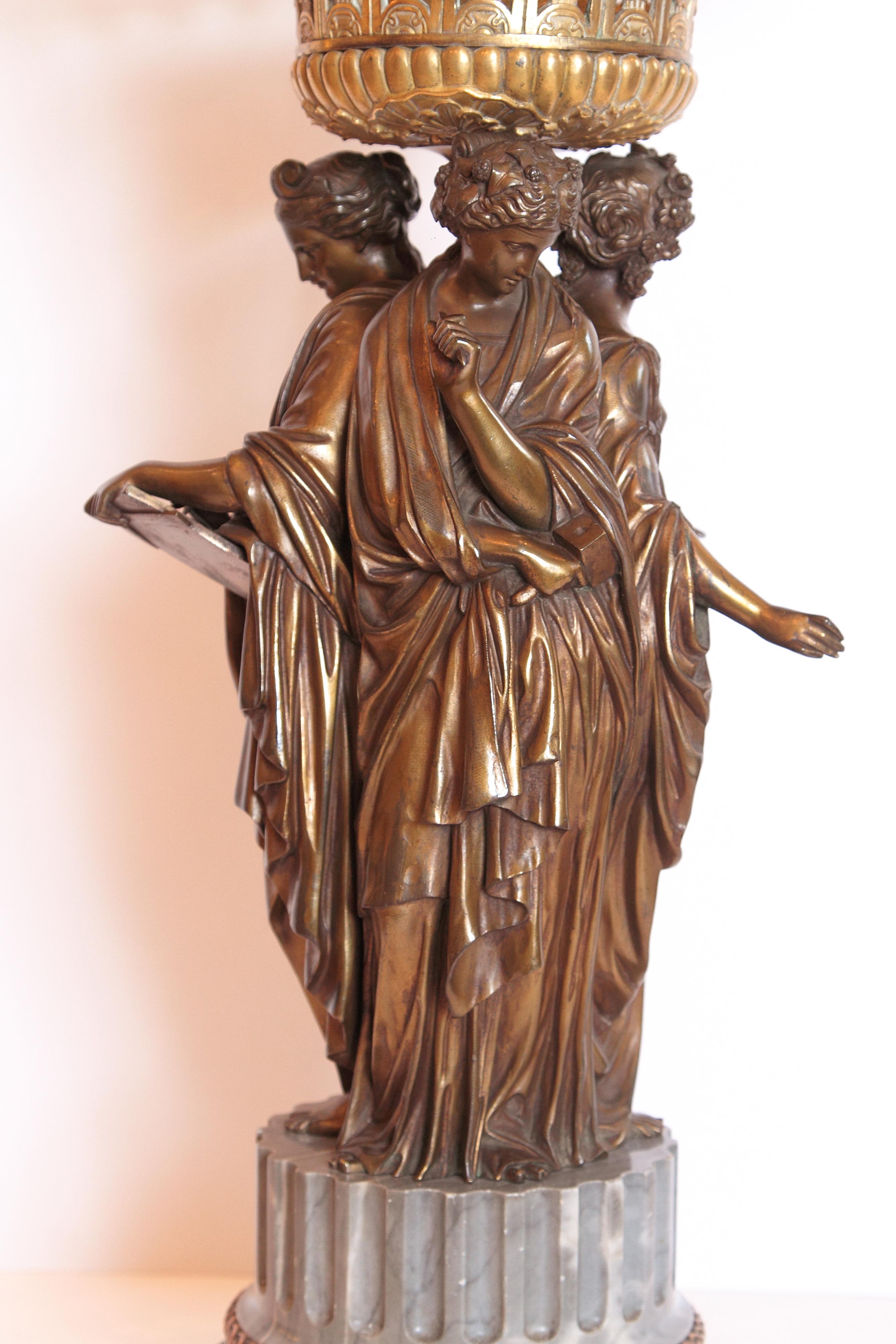 19th century French patinated bronze three graces bronze centerpiece, fine detail with a Waterford signed cut crystal top. Gray column base.