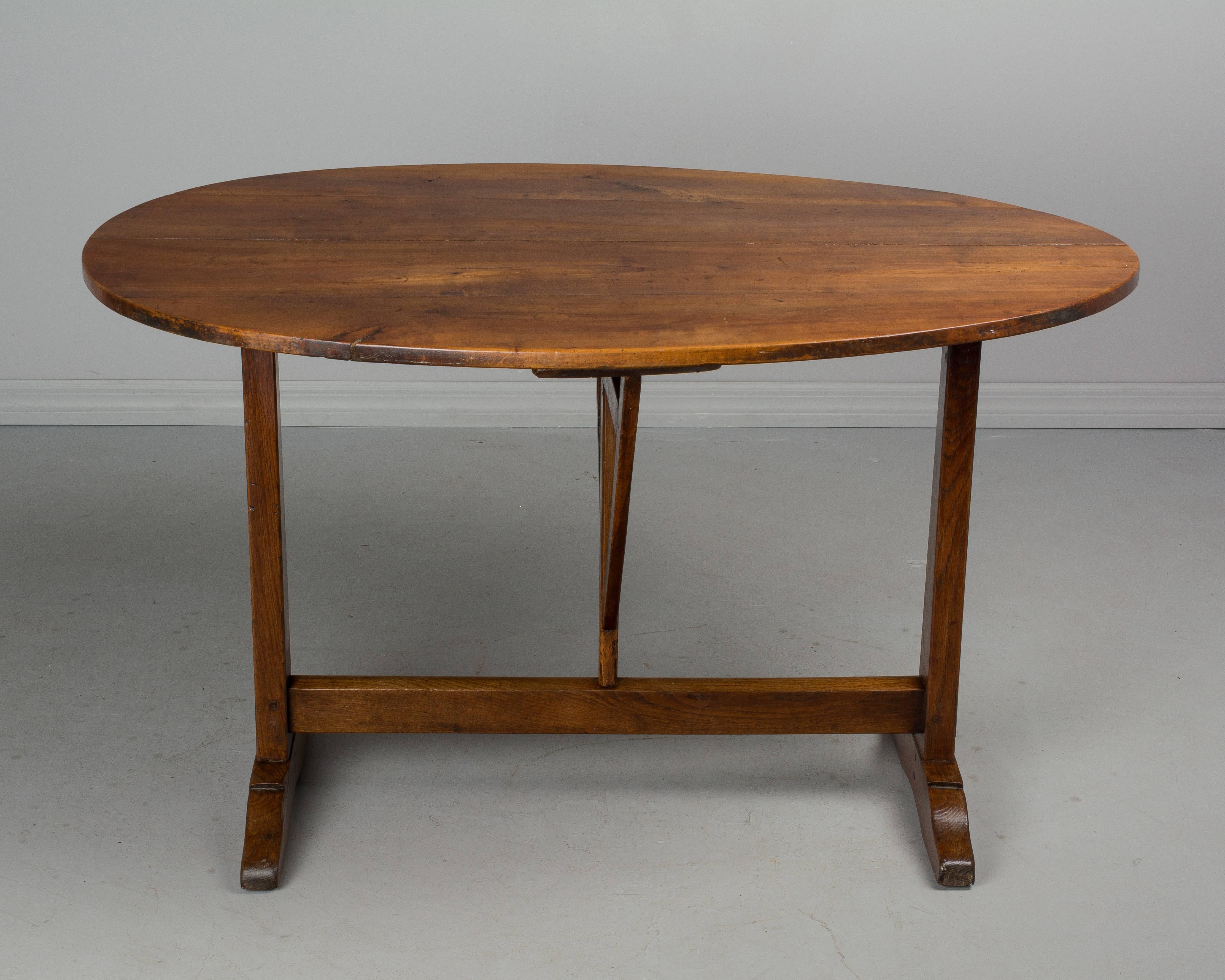 Cherry 19th Century French Tilt-Top Oval Table or Wine Tasting Table