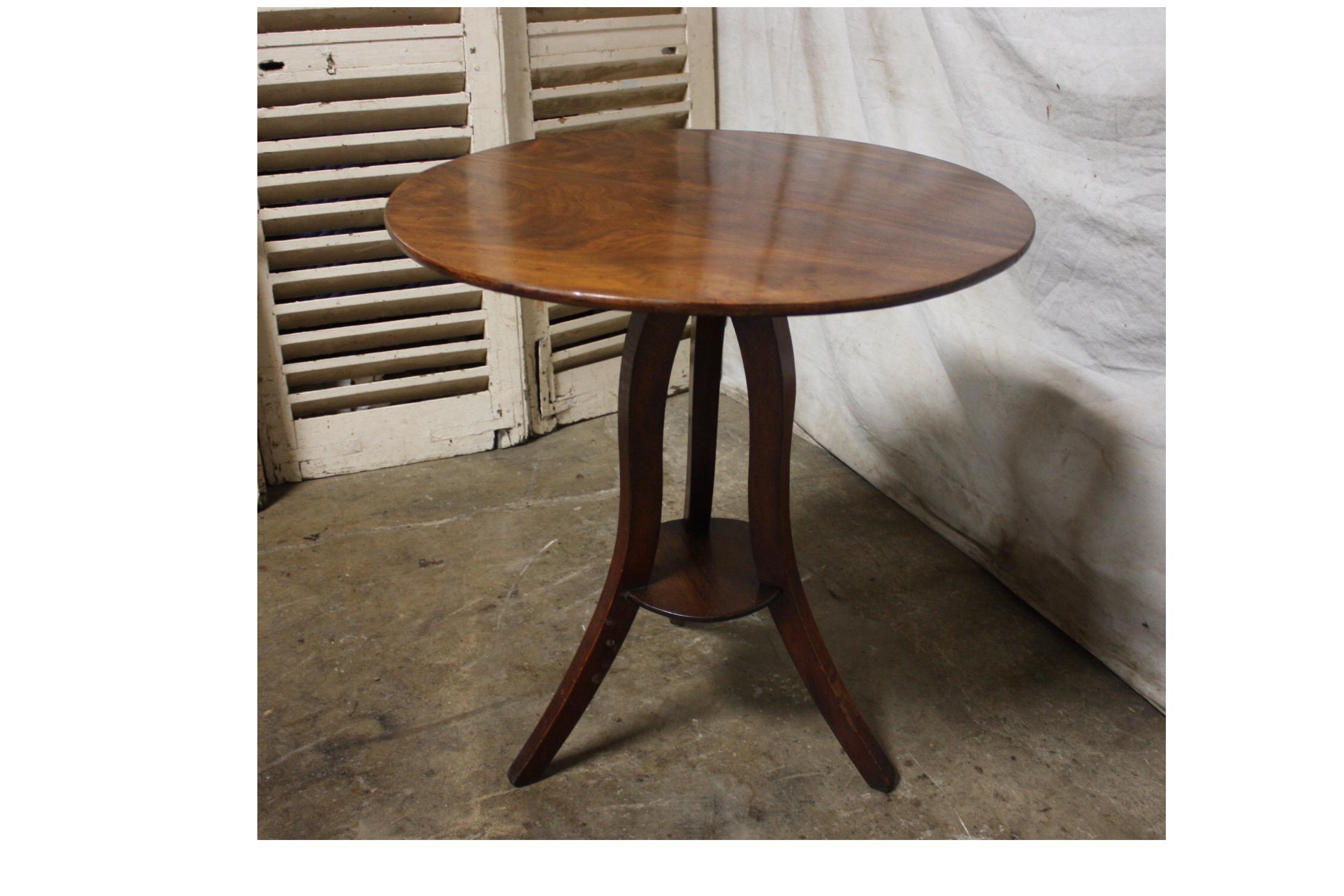 Charming piece, nice movement of the legs. When the table top is stand up the height is 41.75''H.