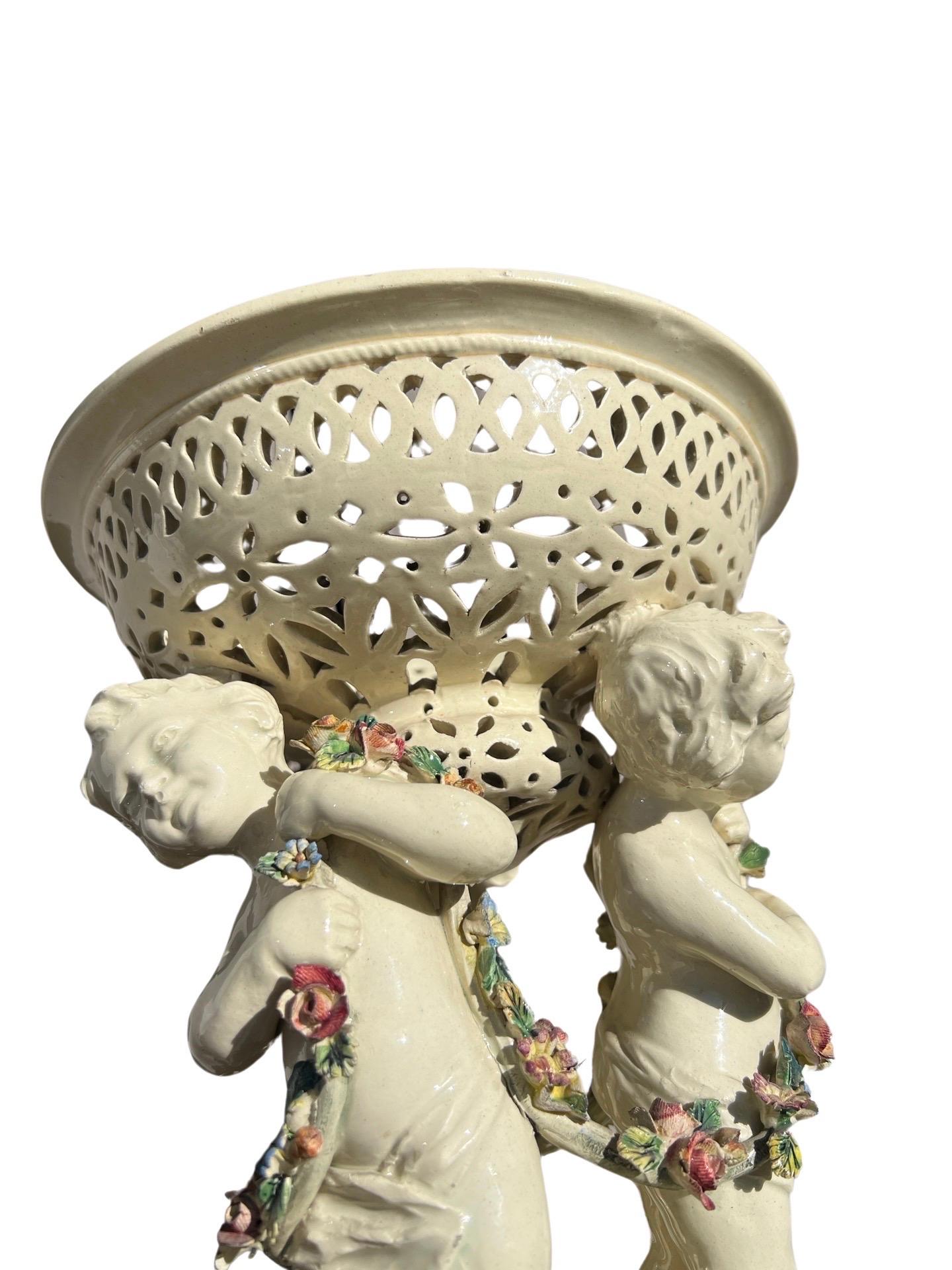 19th Century French Tin Glazed Creamware Centerpiece Adorned With Putti Supports For Sale 4