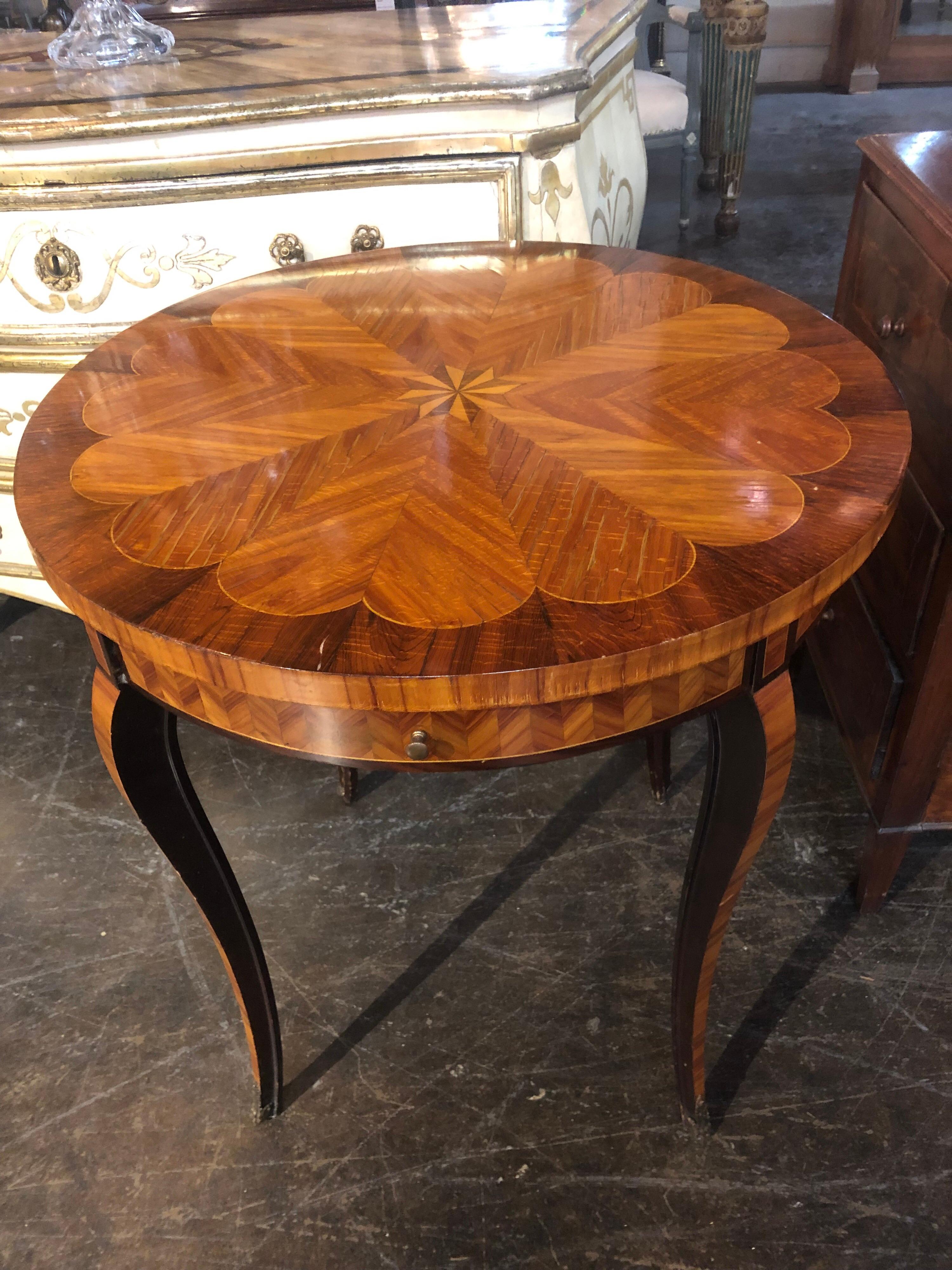 Lovely mahogany side table inlaid with intricate design. Fine craftsmanship makes this a beautiful piece for an elegant home.