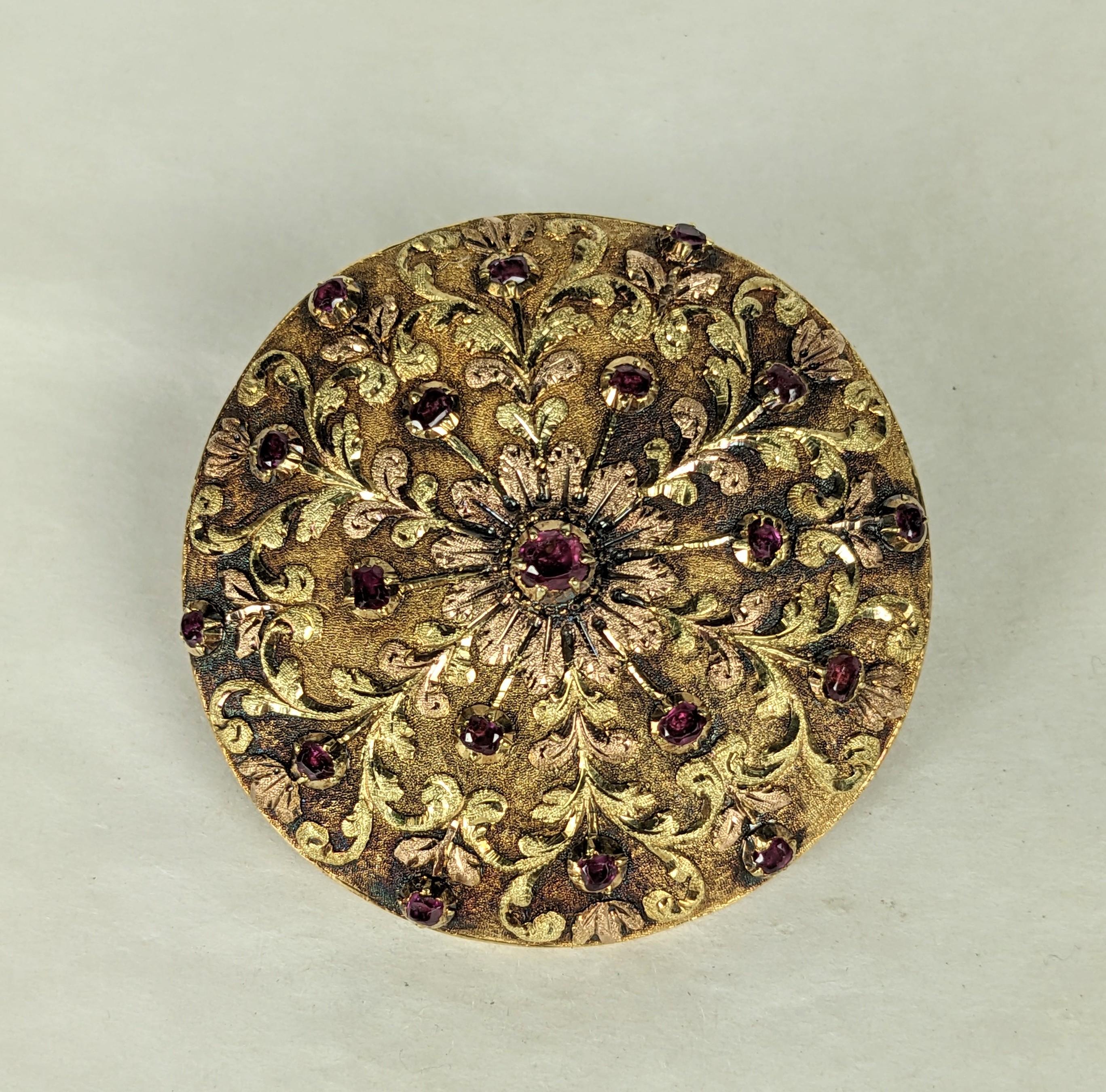 French Tri Color Gold Ruby Brooch set in 18k gold from the 19th Century, Originally a cover for a fancy pocket watch, this was converted in the period into a brooch with bale for pendant use. Intricate hand made gold work in green, pink and yellow