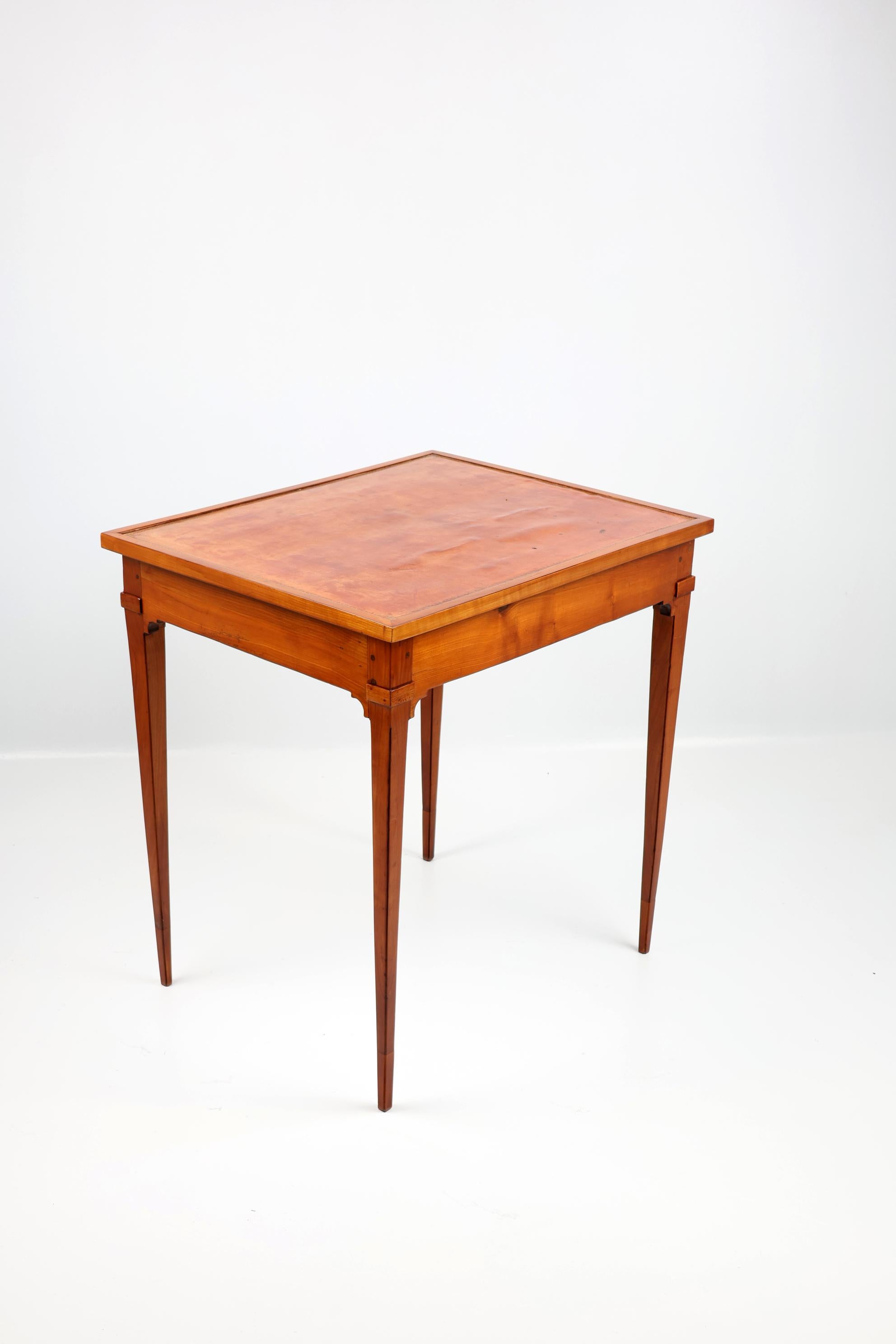 Early XIX century Tric Trac French Game Table,
1810-1820 France,
Cherry wood

Early XIX century Tric Trac game Table made of solid cherry wood with reversible top and marquetry. 
The table boasts a reversible top that's as functional as it is