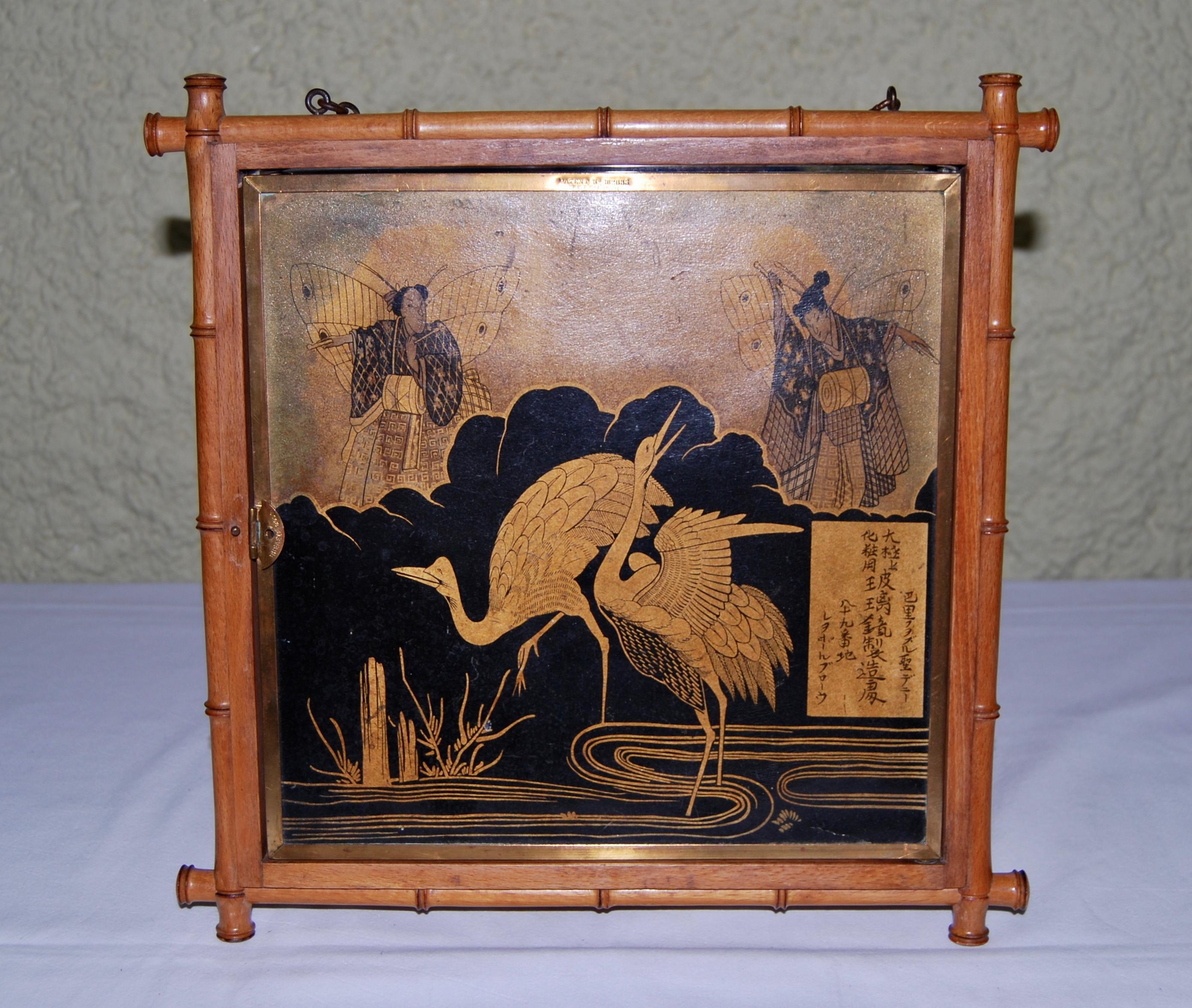 Very fine example of a triptych wall mirror with Japanese decor. 
Faux bamboo wood frame with brass surround. 
The three mirrors are in superb condition. 
Signed 'L.B.'  for Ludger Tiburge Berton and dated September 26, 1876, patent no. 182633