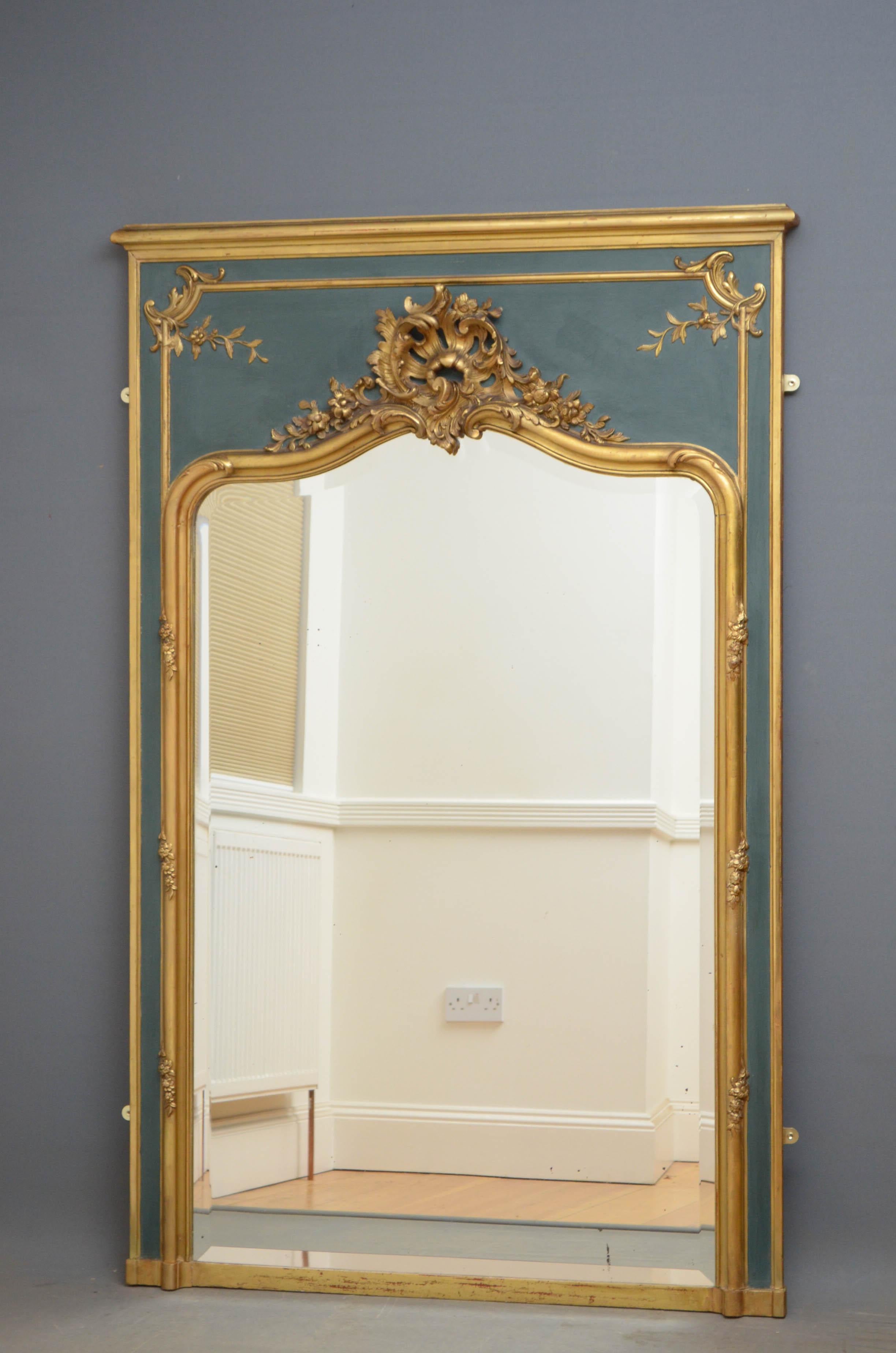 Sn4760 elegant French floor standing or wall hanging mirror, having original bevelled edge mirror with some foxing in gilded frame with floral crest to top on the dark green backdrop.
This antique is in excellent home ready condition, circa