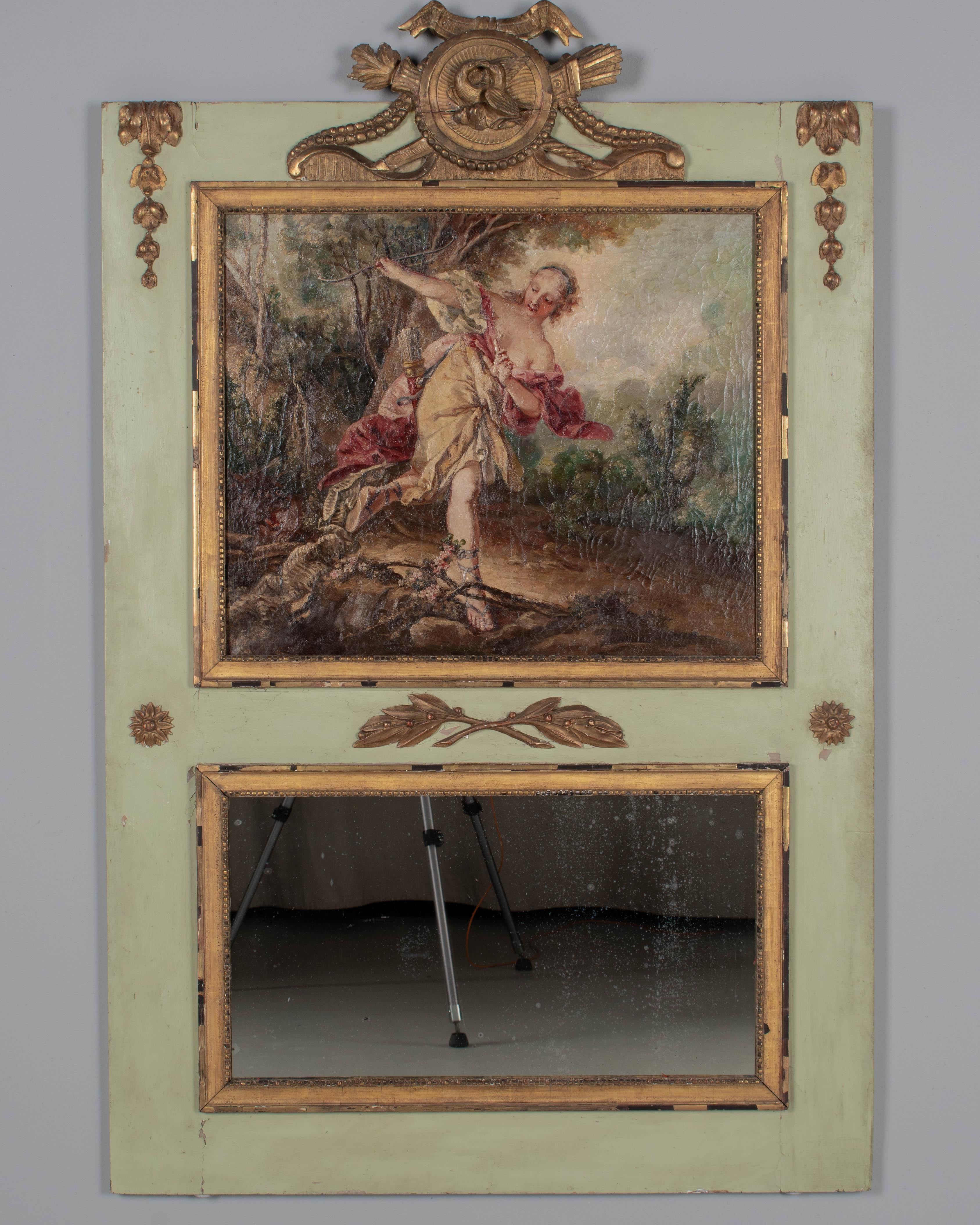 Specchio trumeau francese in stile Luigi XVI dell'inizio del XIX secolo con un grande dipinto raffigurante Diana, la dea della caccia. Olio su tela con colori vivaci, craquelure, con alcune perdite di vernice, in-verniciatura e una toppa riparata.