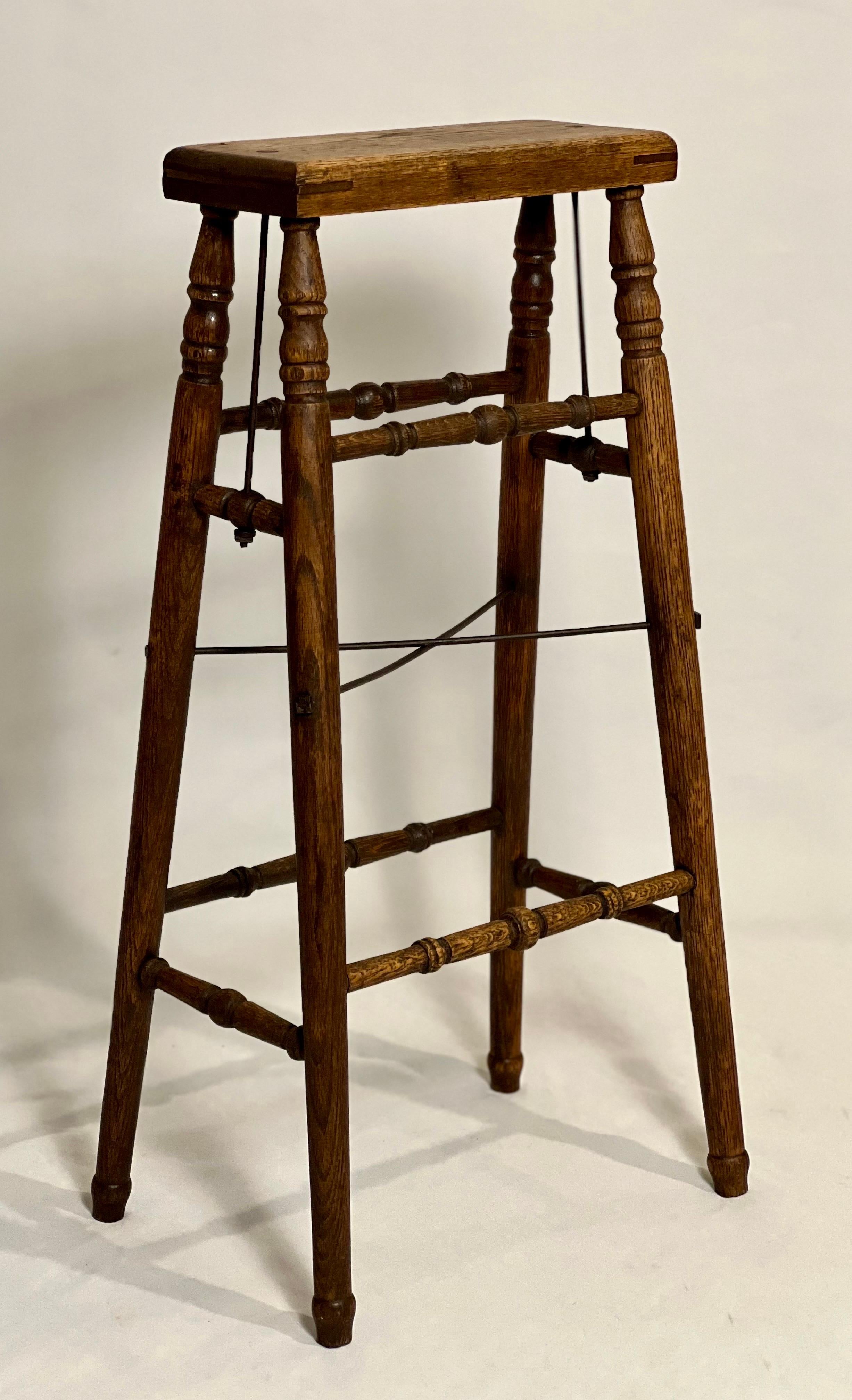 Antique oak and iron artist's stand or stool, France circa 1850s.

A rare style oak artist's stand with nicely turned legs and iron reinforcements. The complexity of the base is uniquely beautiful. The industrial element of the iron artfully
