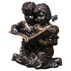 Composizione per bambini in bronzo bicolore francese del XIX secolo "Libro di lettura per bambini".