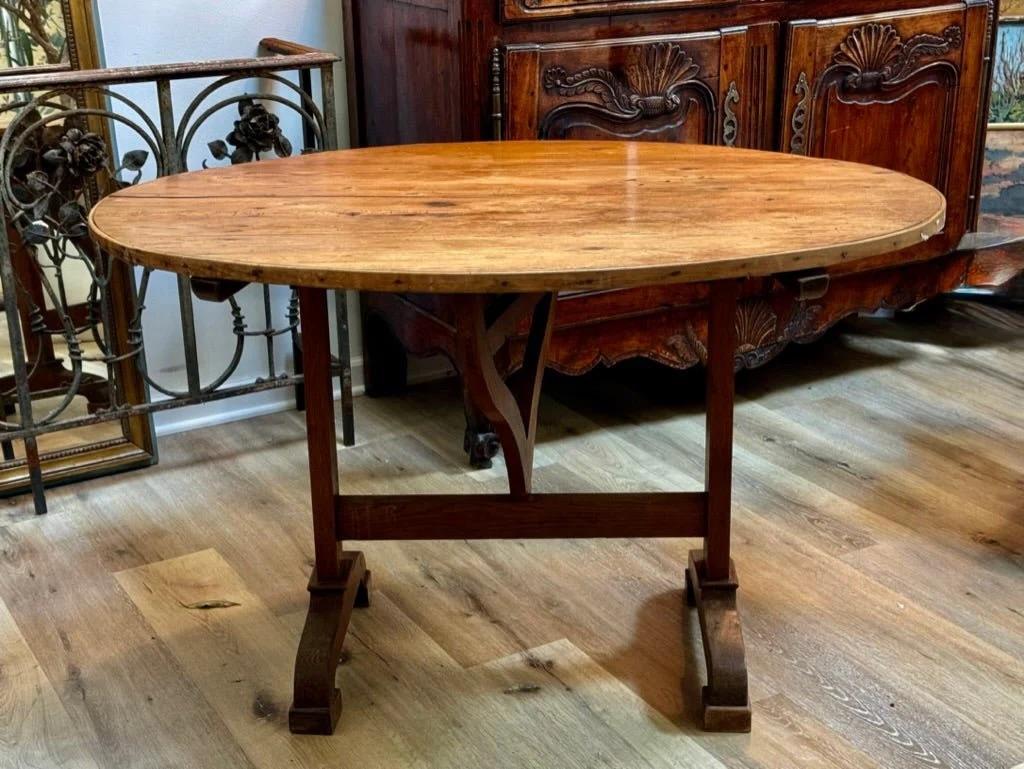 French Vintner’s Wine Tasting Table with Tilt-top and butterfly wedge support.  19th Century. This round wine table was found in the south of France.  28.5” h. x 45” diam.

