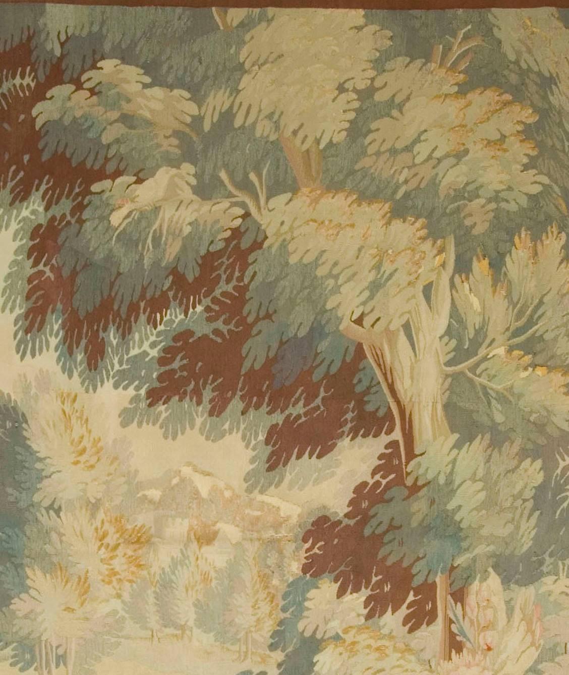 19th century French Verdure tapestry, circa 1850, 5'7 x 9'1.  A wool and silk tapestry depicting a goose in a verdure wooded scene trees and leaves enhance the scene and the tapestry is surrounded by a wide floral border. 5ft.07in wide x 9ft.01in