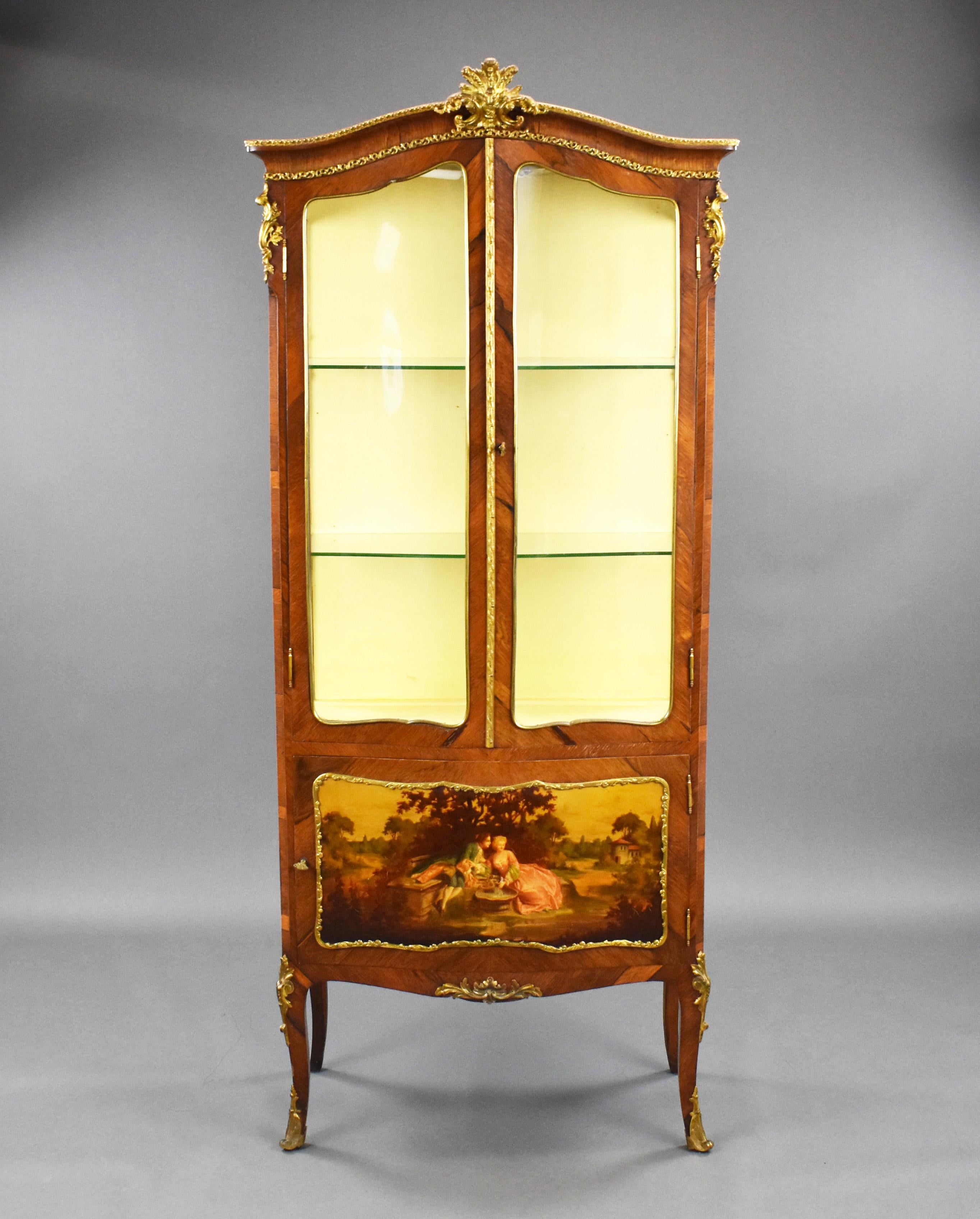 Good quality late 19th century French kingwood and ormulu mounted vitrine display cabinet with domed top, two glazed doors enclosing two glass shelves with a cupboard below with painted Vernis Martin romantic scene decoration on scroll legs.