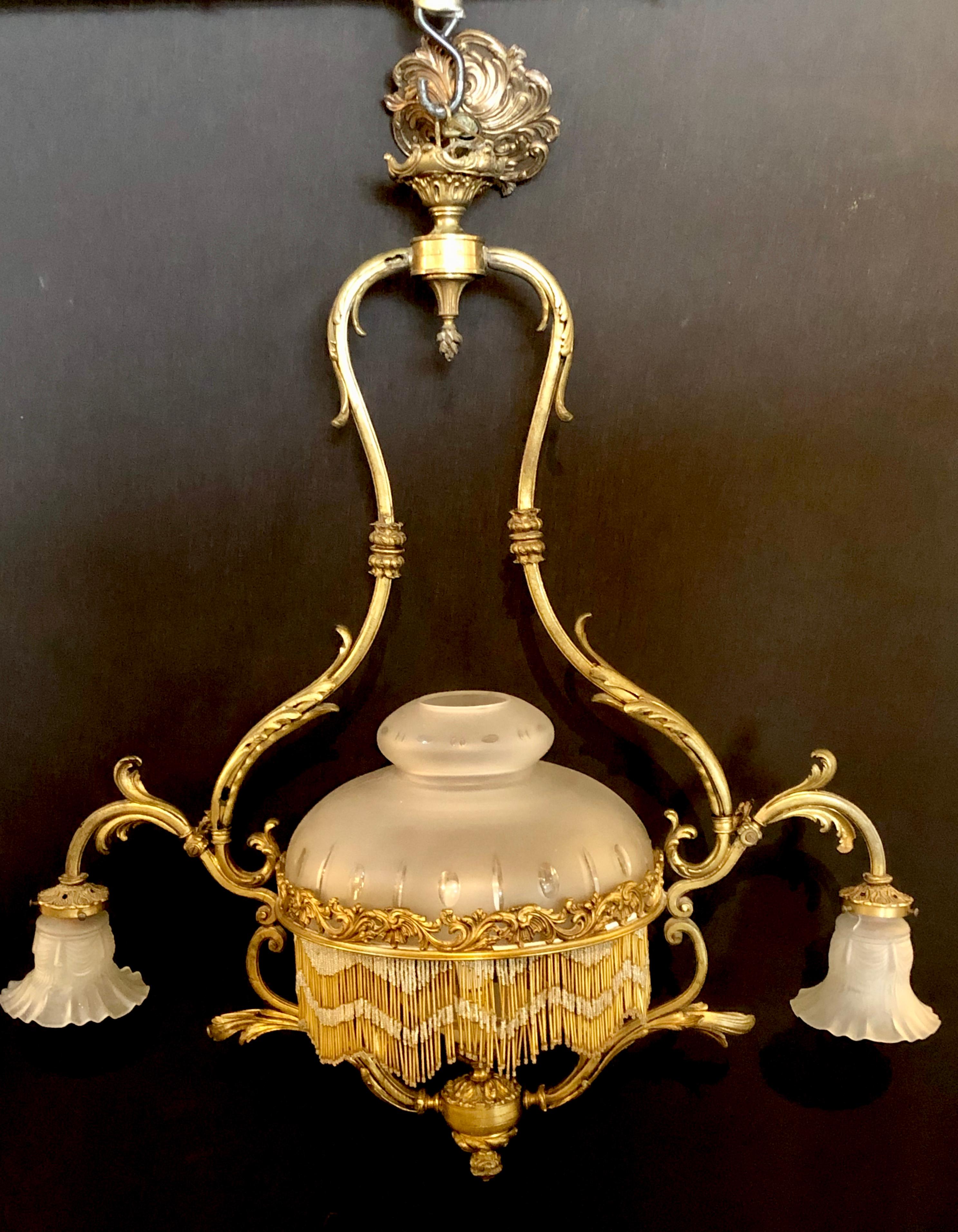19th century French Victorian bronze chandelier having frosted shades, taking 3 bulbs this stunning chandelier is perfect for a billiards table or entryway.