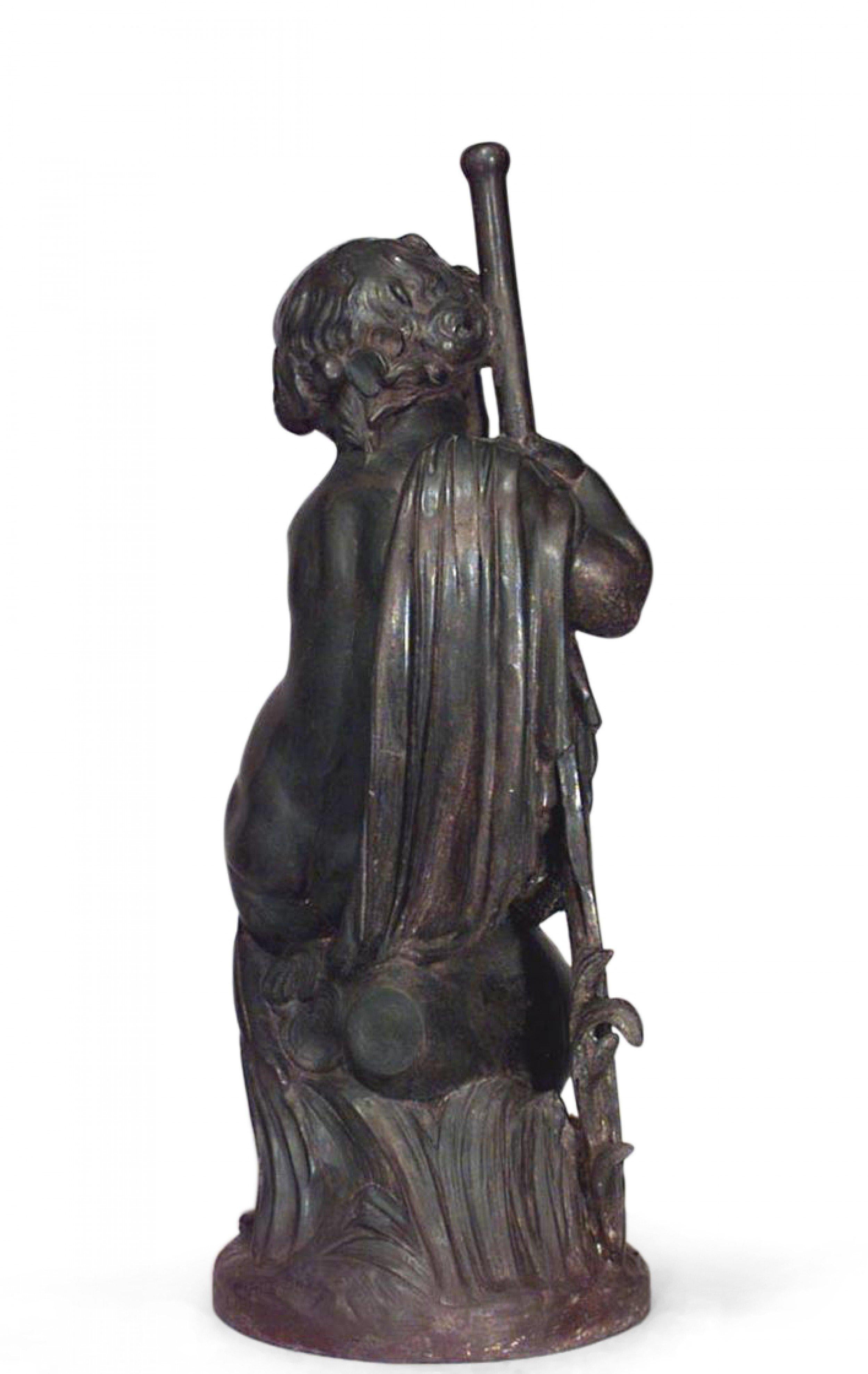19th Century French Victorian cast iron allegorical fountain figure of a putti seated on an overturned amphora while holding a paddle.
 