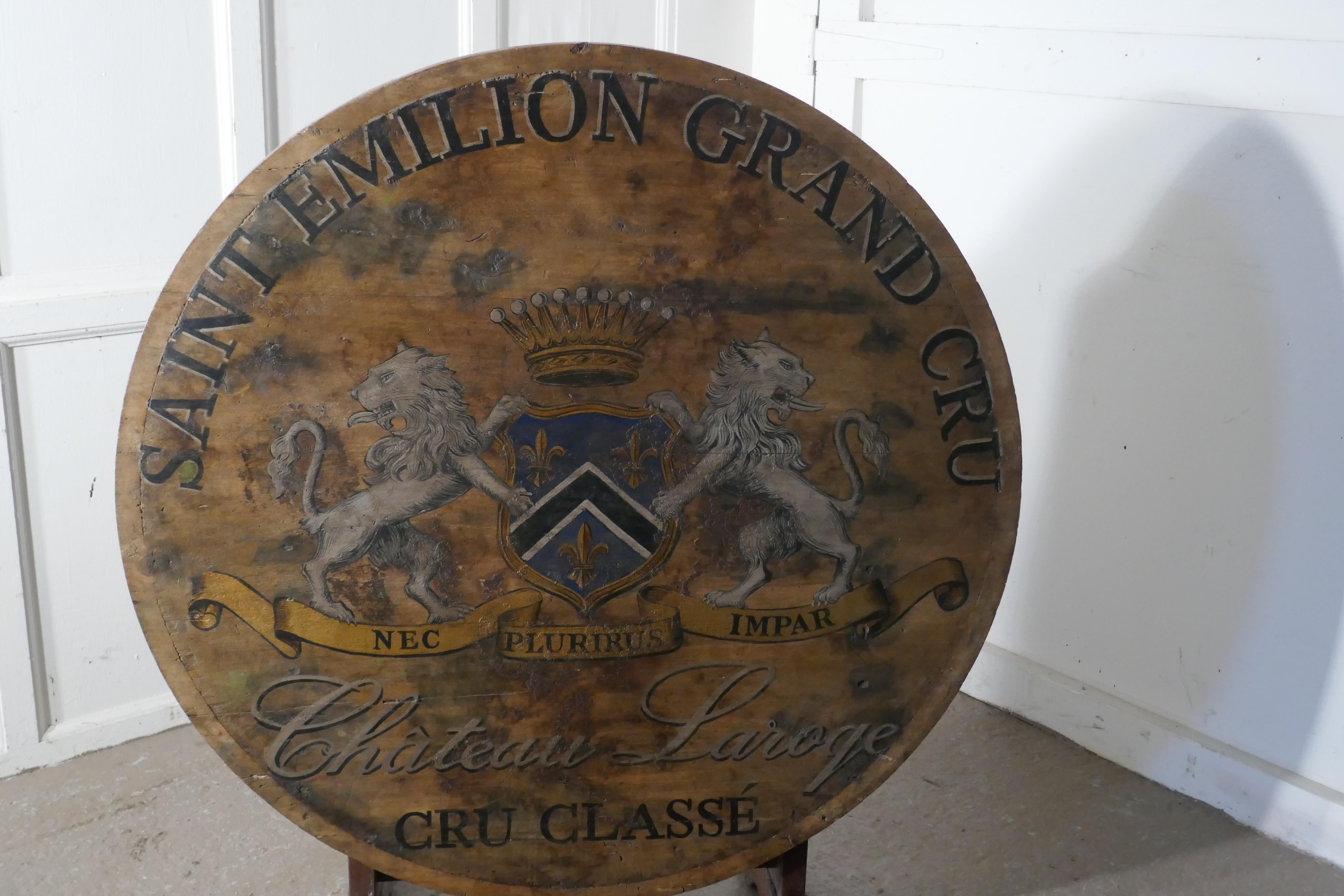 19th century French vineyard wine table from Chateau Laroge, Saint Emilion

This is an old wooden painted table, is painted with the coat of Arms of the Chateau Laroge, St Emillion and would have been used in the Chateau as a serving table for