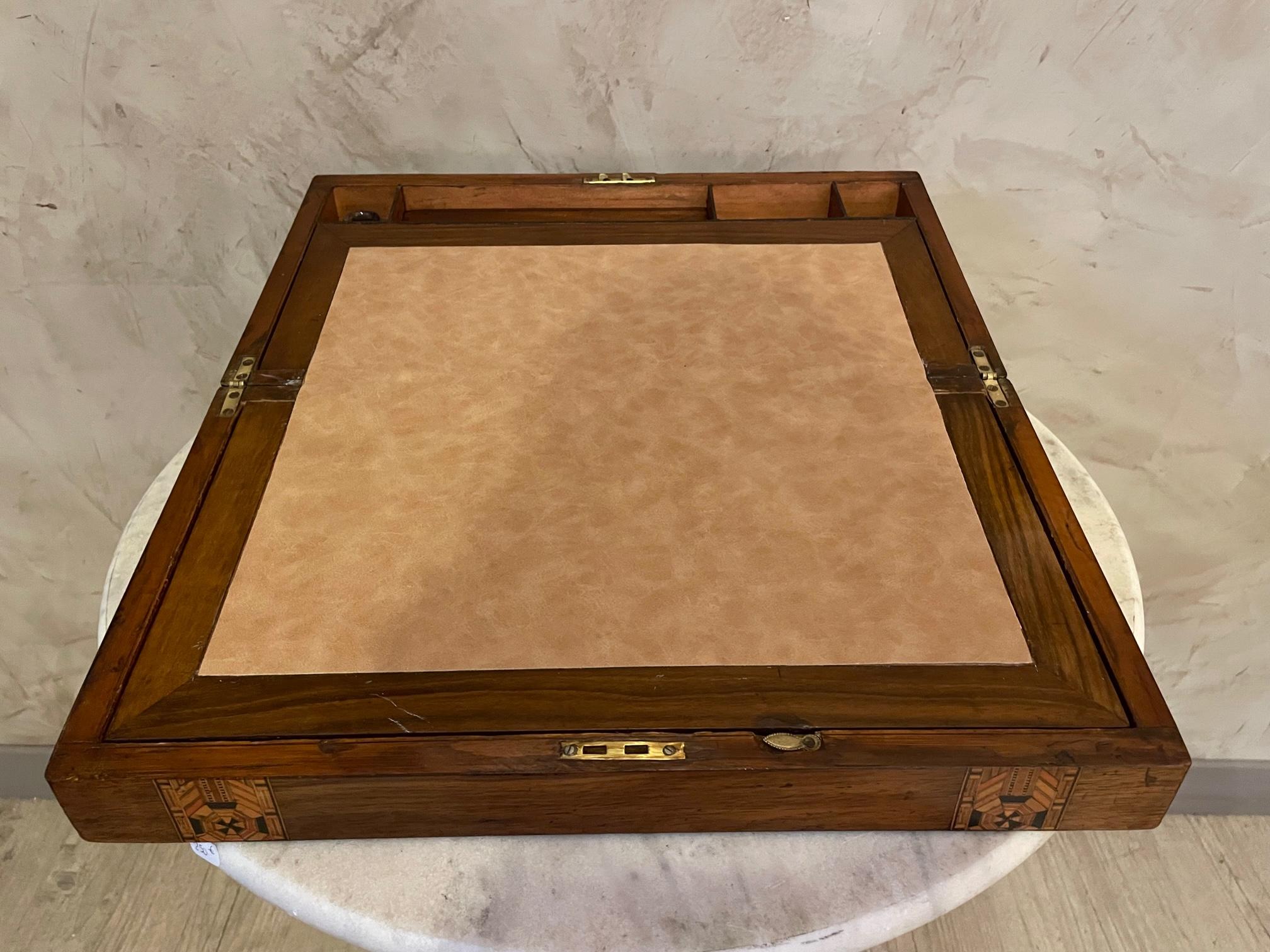 Beautiful walnut desktop box which opens into a writing slope. 
Decorated on the outside with 2 decorative inlaid tunbridge ware bands. 
Box opens out to a beige fabric writing slope which opens both ways to allow access for further storage. No