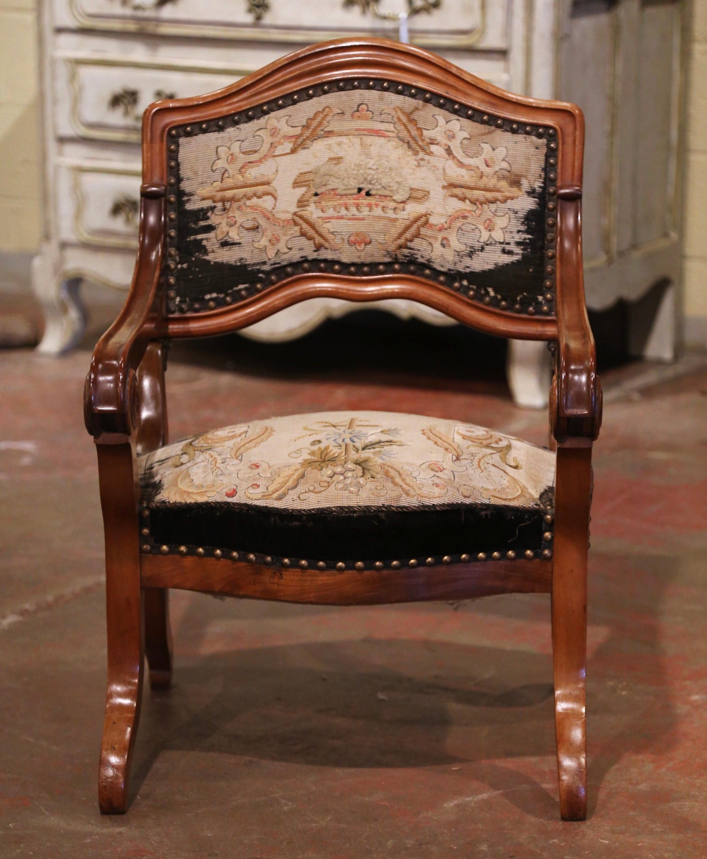 This rare, carved fruitwood “Prie-Dieu” (prayer chair in French), was crafted in France, circa 1880. The unique, antique chair is easily transformed and can open up to a tall prayer bench. The Louis Philippe kneeler stands on four curved legs with